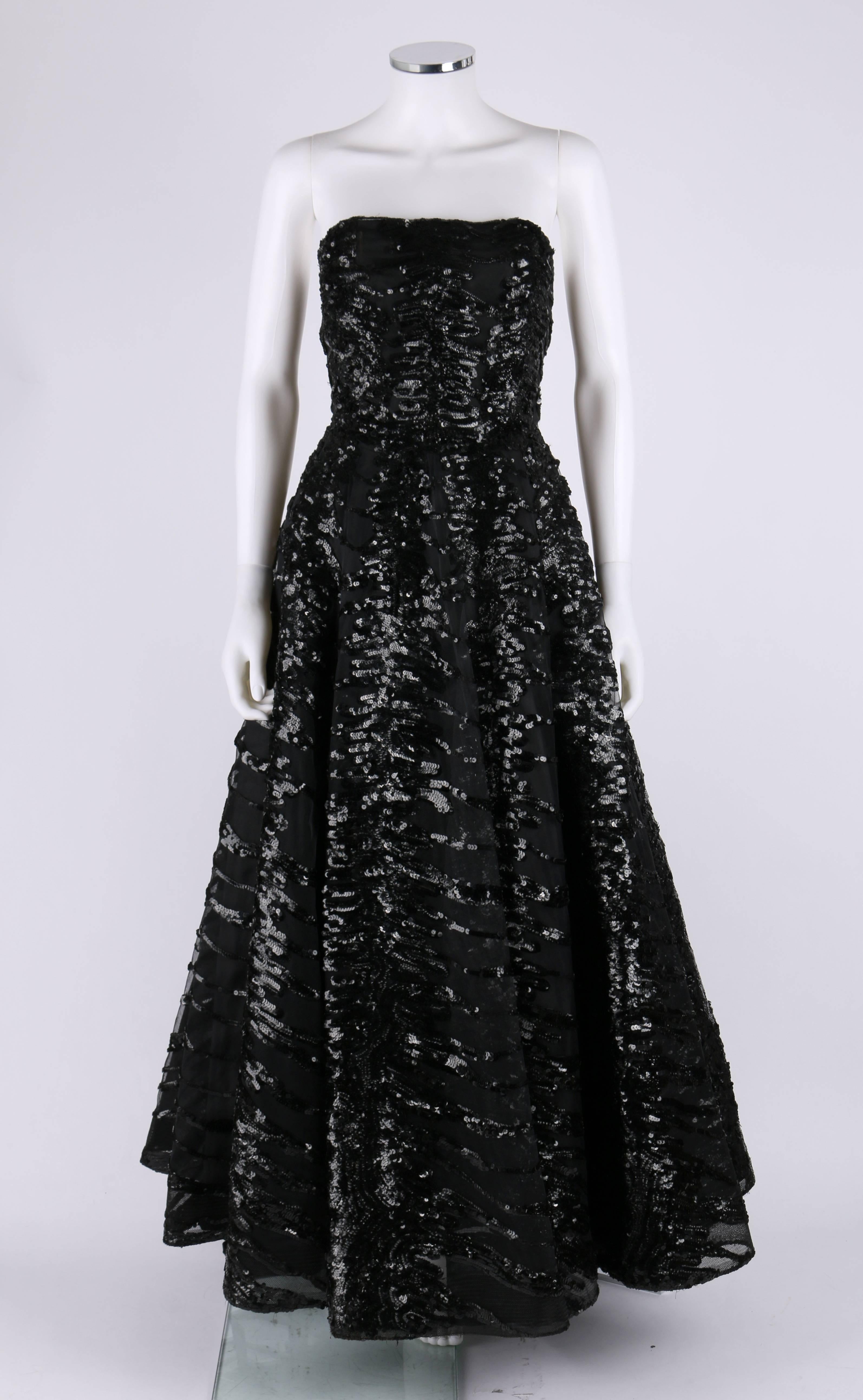 Amazing vintage ball gown custom made for 1950s opera singer Alberta Hopkins. Net overdress is heavily embellished with glossy and textured black sequins. Strapless bodice is boned and has an internal grosgrain ribbon waistband. The hemline of the