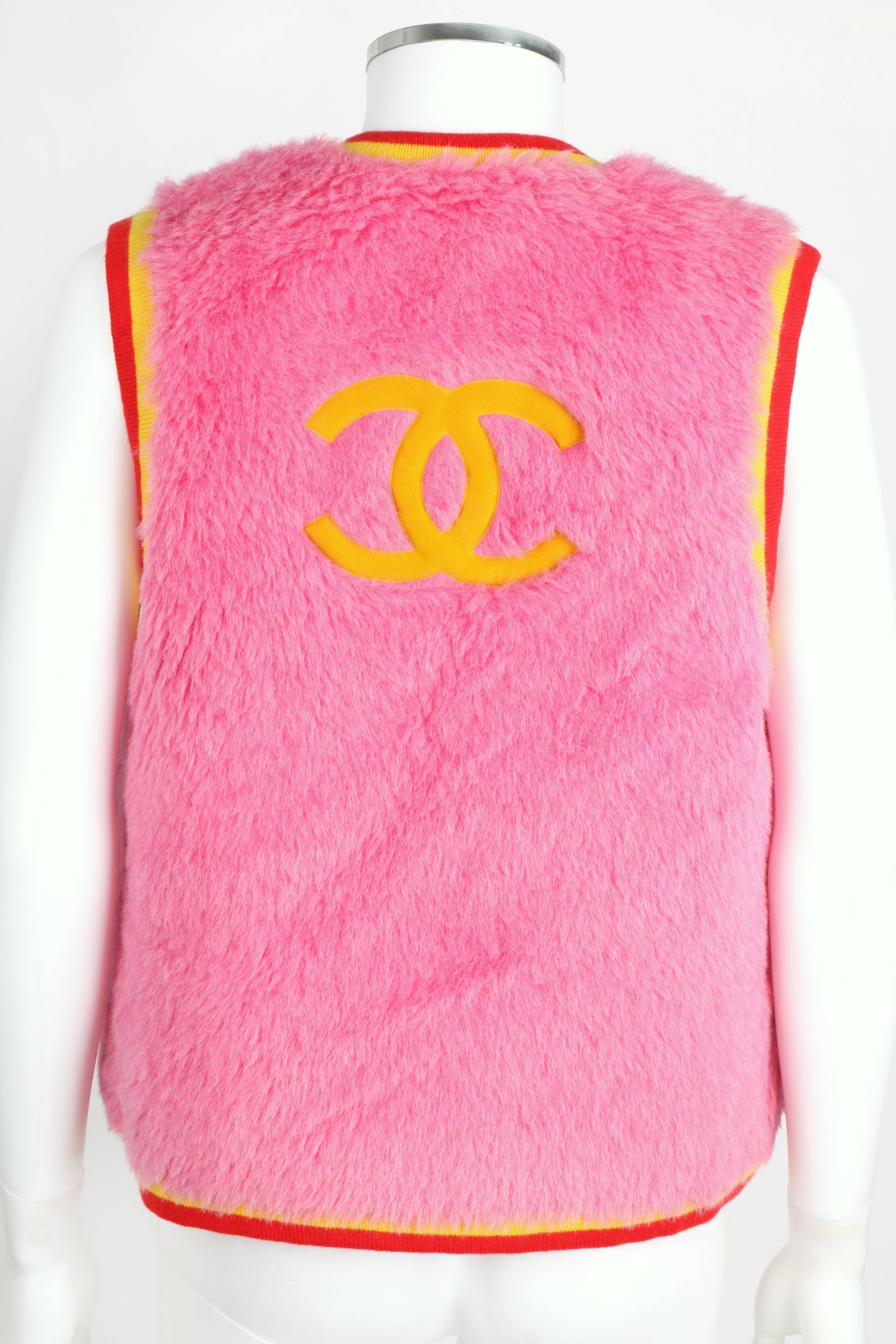 Rare Chanel bubblegum pink furry alpaca blend vest from the Autumn-Winter 1994 collection.  Vest is trimmed in bright yellow and red cashmere knit.  Four small pockets at front.  Large velveteen 