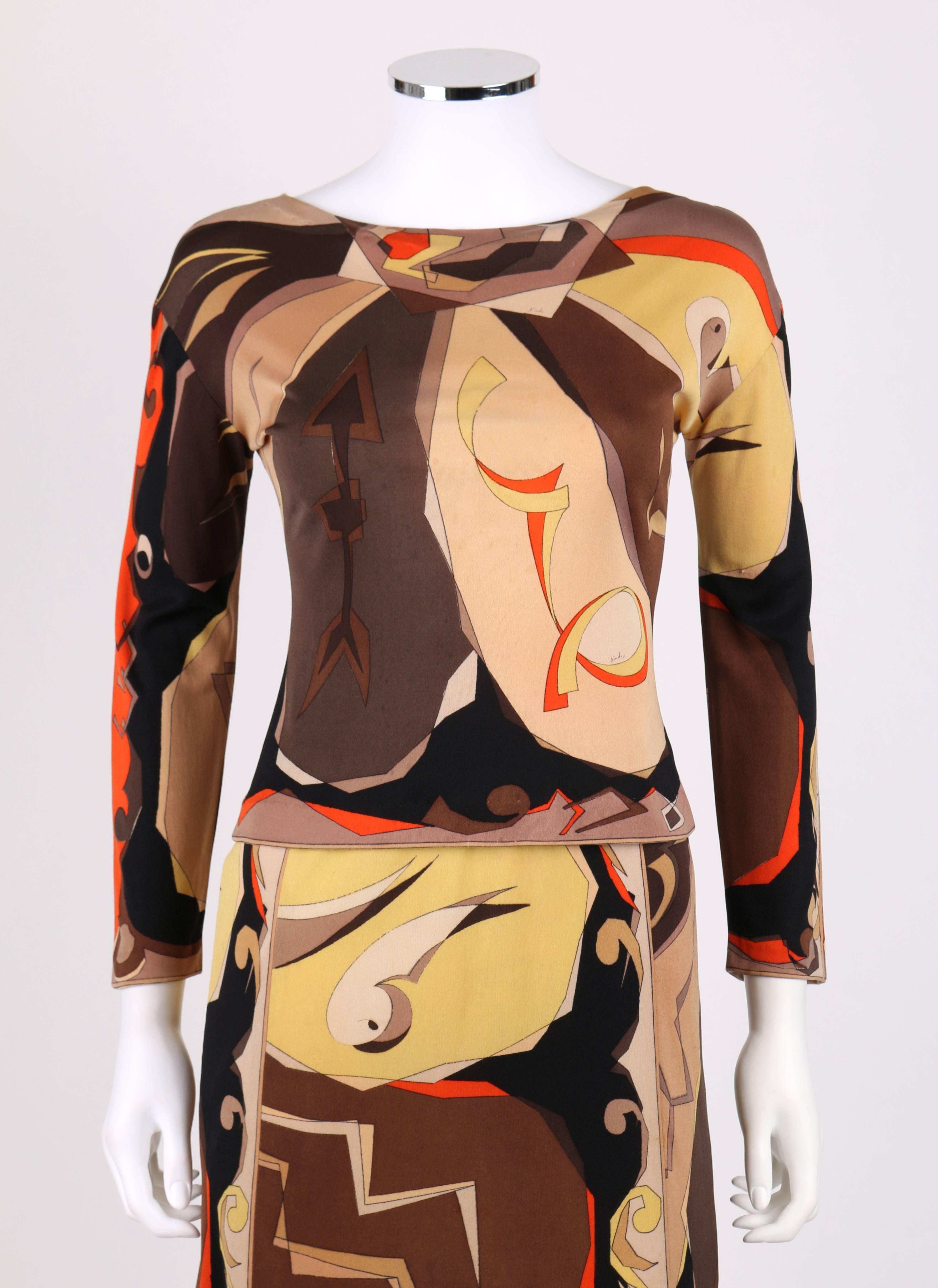 Vintage c.1960s Emilio Pucci two piece silk jersey top and skirt set. All over brown, orange and yellow abstract arrow signature print. Bateau neckline and wrist-length sleeves. A-line skirt with an elastic waistband. Marked Fabric Content: 
