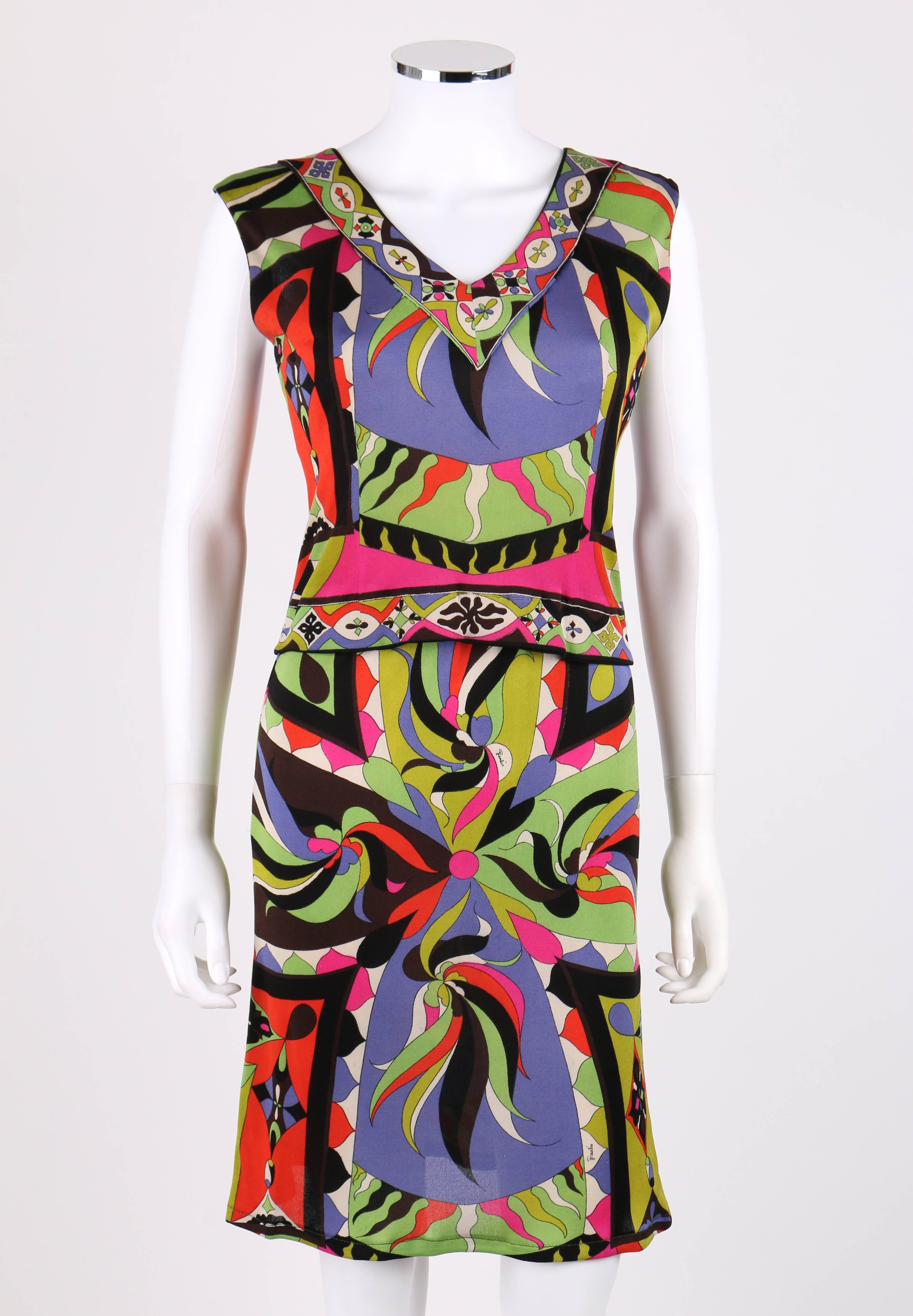 Vintage c.1960s Emilio Pucci multi-color abstract signature print silk jersey two piece set. Sleeveless v-neckline top/shell with decorative border on neckline and hem. Center back button closure. Straight skirt with elastic waistband.  Marked