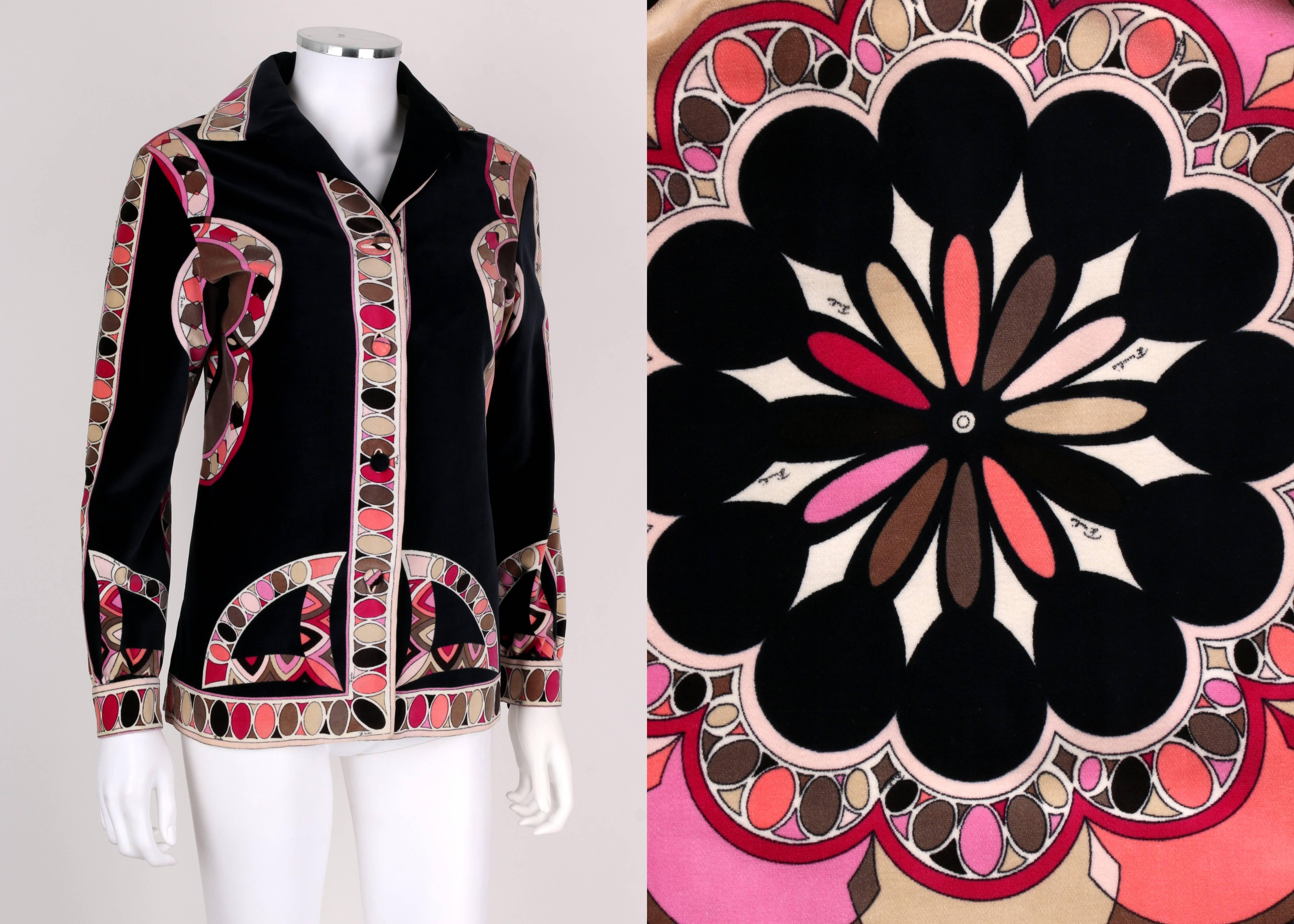 Vintage c.1960s Emilio Pucci black multicolor geometric medallion motif signature print jacket. Long sleeve. Covered button detailing at cuffs. Decorative border along collar, cuffs, button closure, and waist. Center front button closure with four