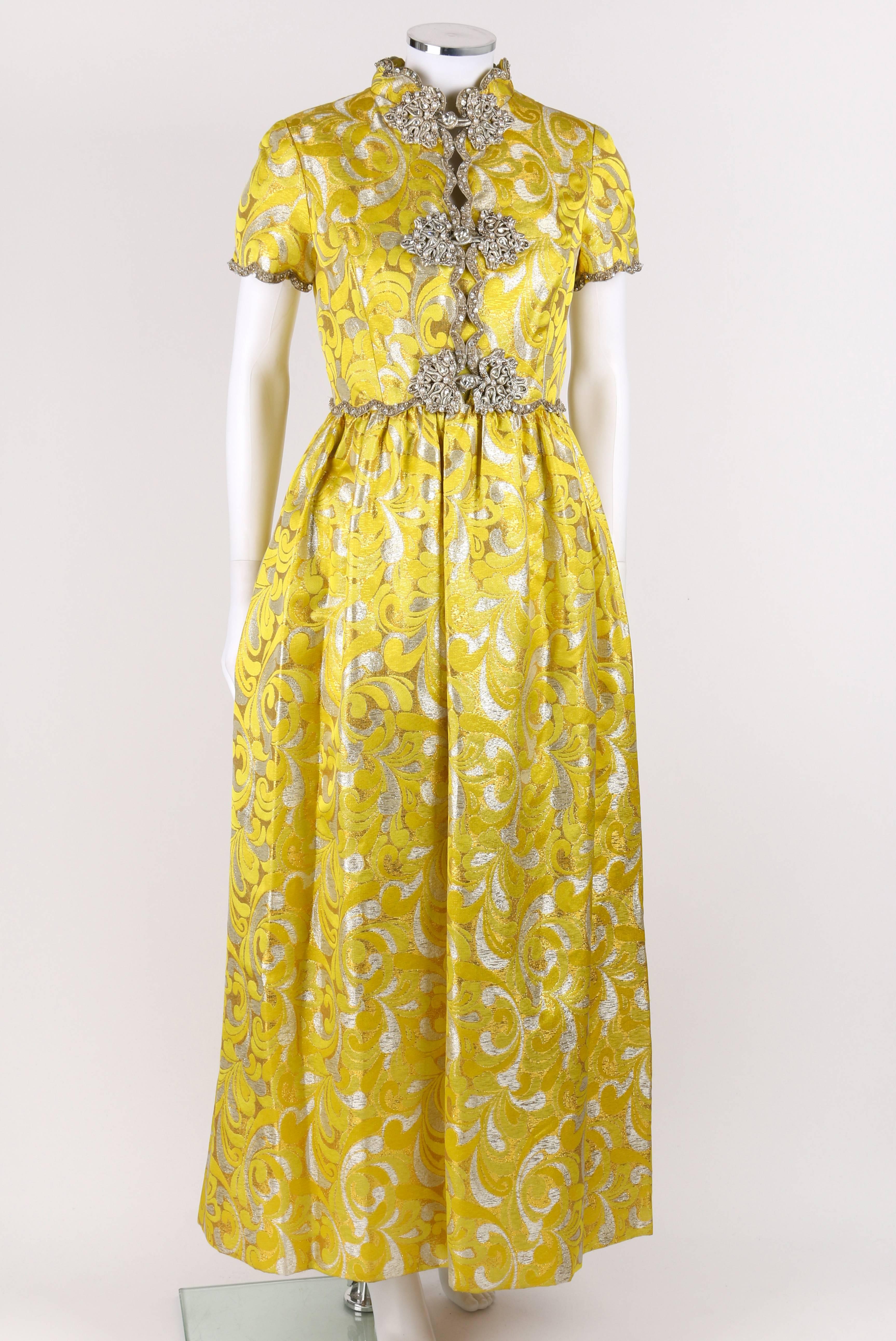 Vintage Oscar de la Renta c.1968 yellow and silver lurex brocade silk evening gown. Three gold, pearl, and crystal beaded frog closures down center front. Scalloped beaded trim around neckline, waistline, and cuffs. Two hip pockets. Short sleeve.