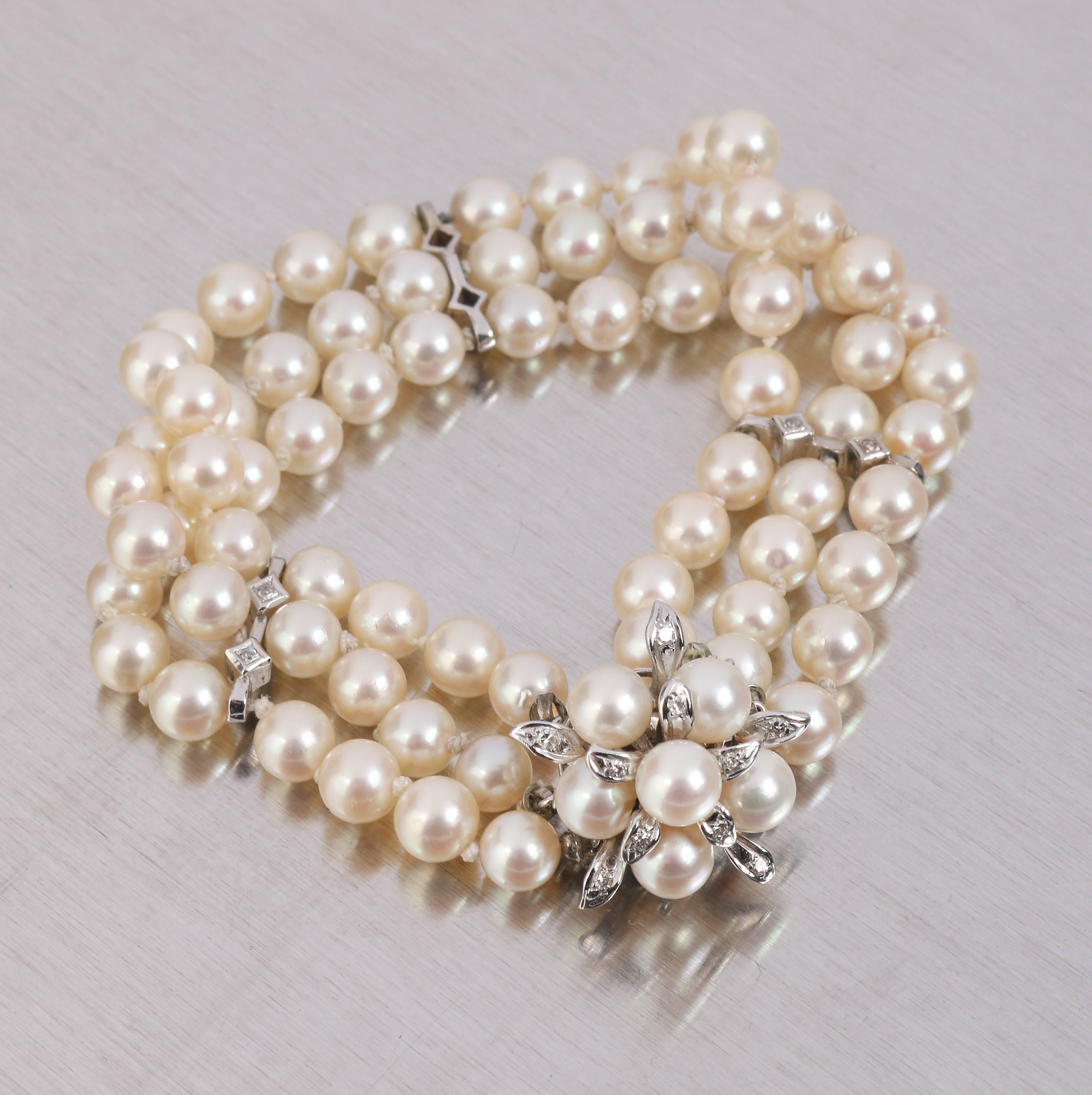 Vintage c.1950's Cultured Pearl 3 strand bracelet with 14 kt white gold clasp and spacers. Pearls have a creamy white color with a subtle rose tone (measure approximately 6 to 6.5 mm). The bracelet is divided into 2 sections of 24 pearls, 2 sections