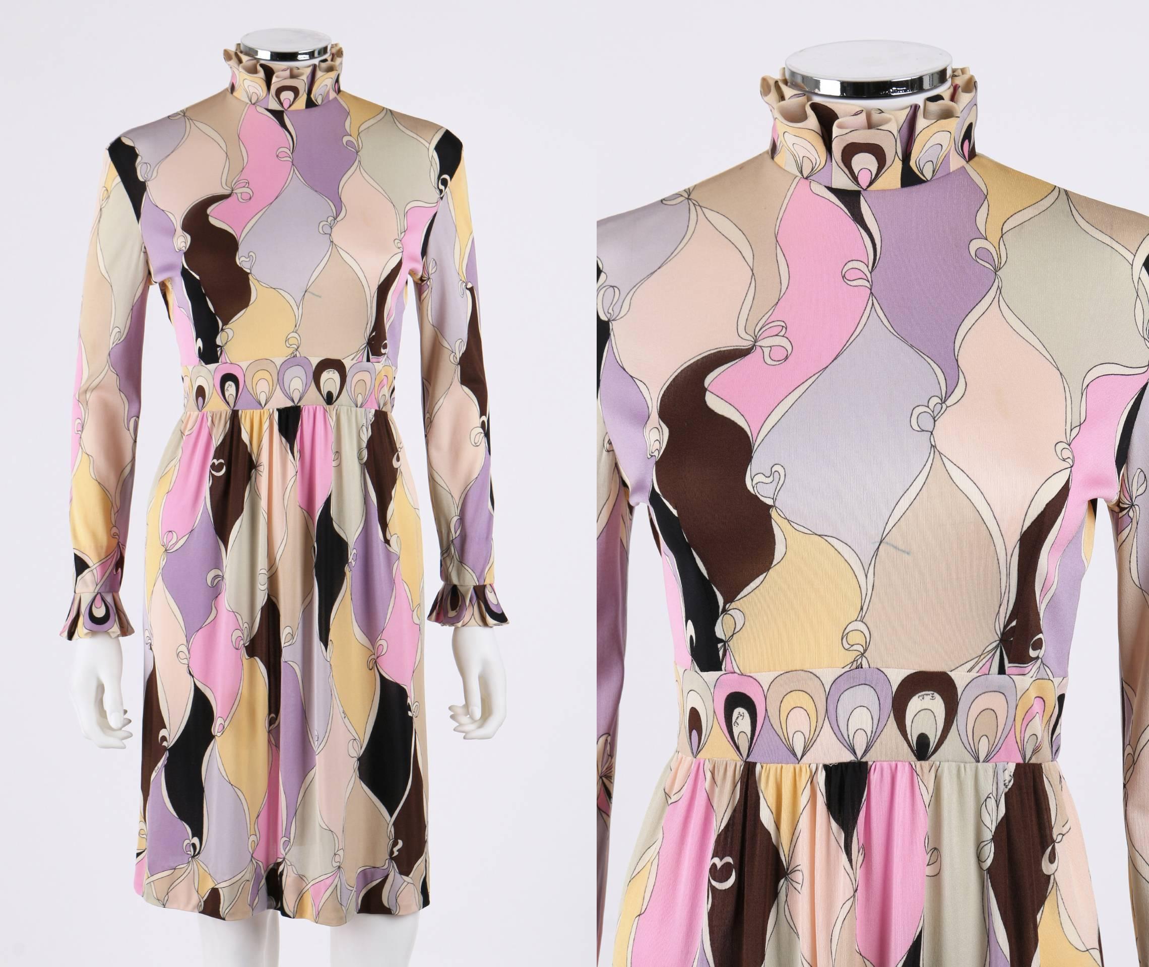 Vintage c.1960's Emilio Pucci multicolor pastel abstract diamond signature print silk jersey dress. Long sleeves. Box pleated mock neckline and cuffs. Yoked waist. Decorative border at collar, waist and cuffs. Center back zipper and hook/eye