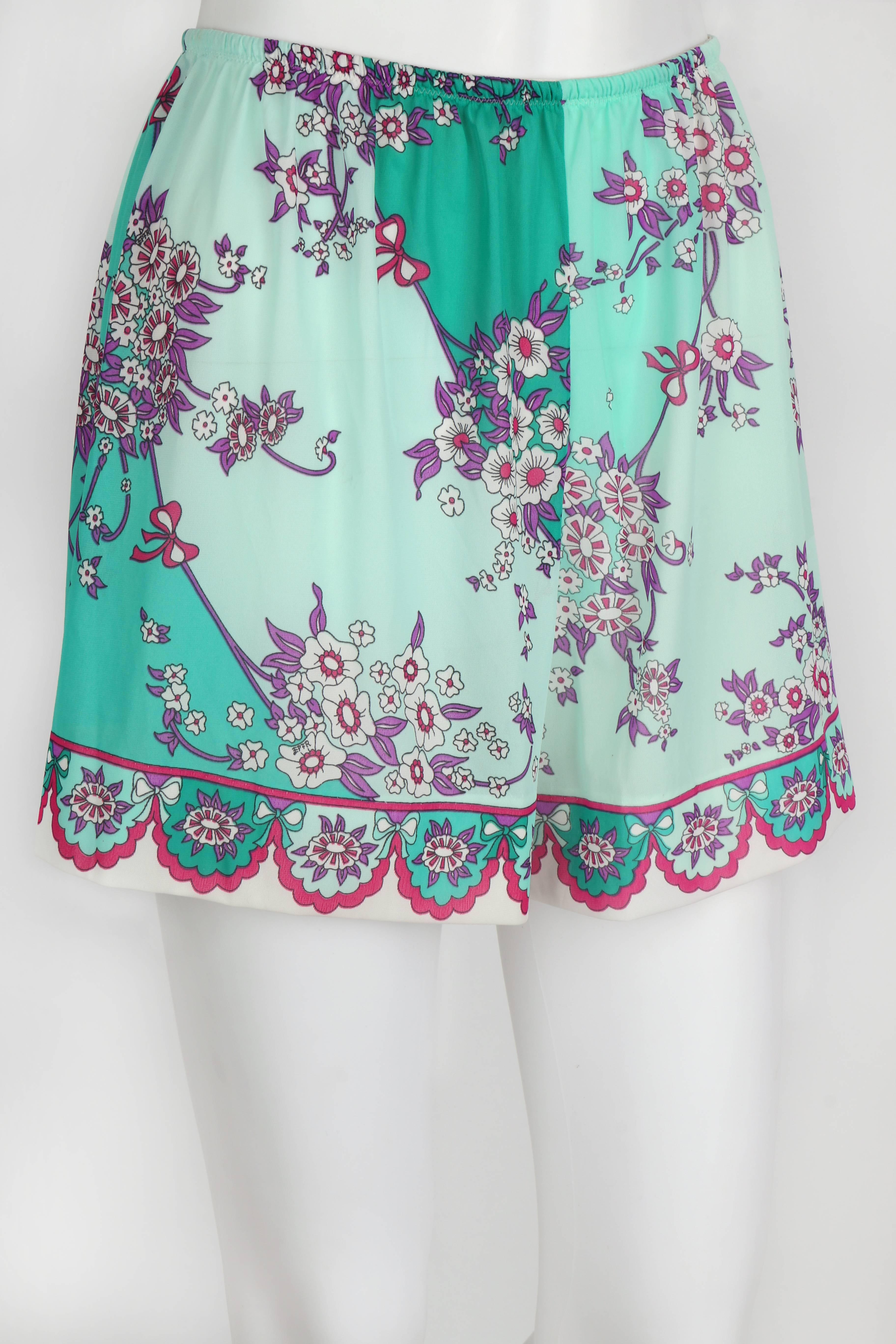 Vintage c.1960's Emilio Pucci for Formfit Rogers floral and bow print tap pants/shorts in shades of mint green / teal and aqua. Op art scalloped floral decorative border on hem. High waisted. Elastic waistband. Unmarked Fabric Content: Nylon tricot.