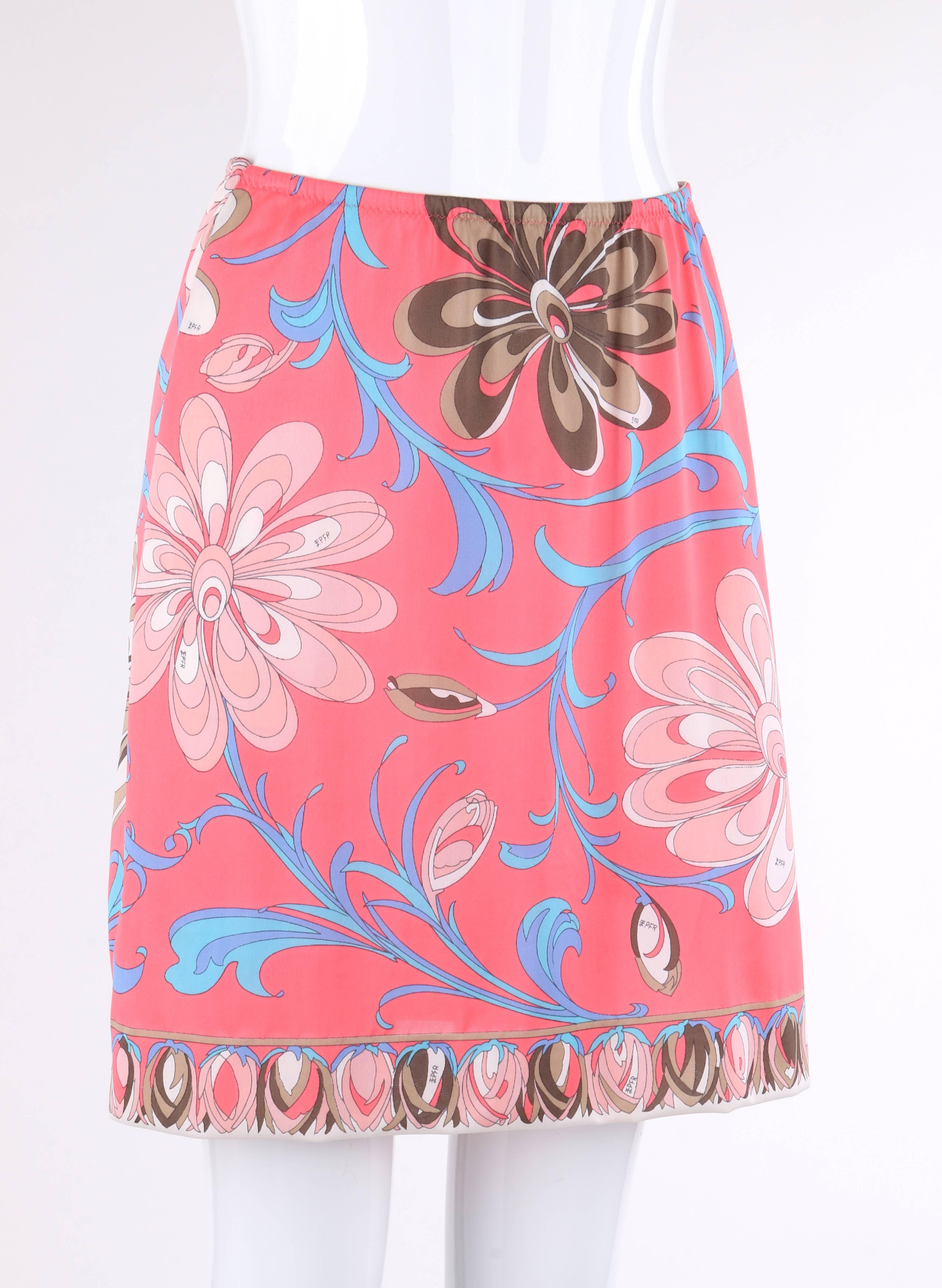 Vintage c.1960's Emilio Pucci for Formfit Rogers pink multicolor floral print slip/skirt. Decorative flower bud border detail on hem and back. Elastic waistband. Skirt has been taken in slightly at each side and re-hemmed. Marked Fabric Content:
