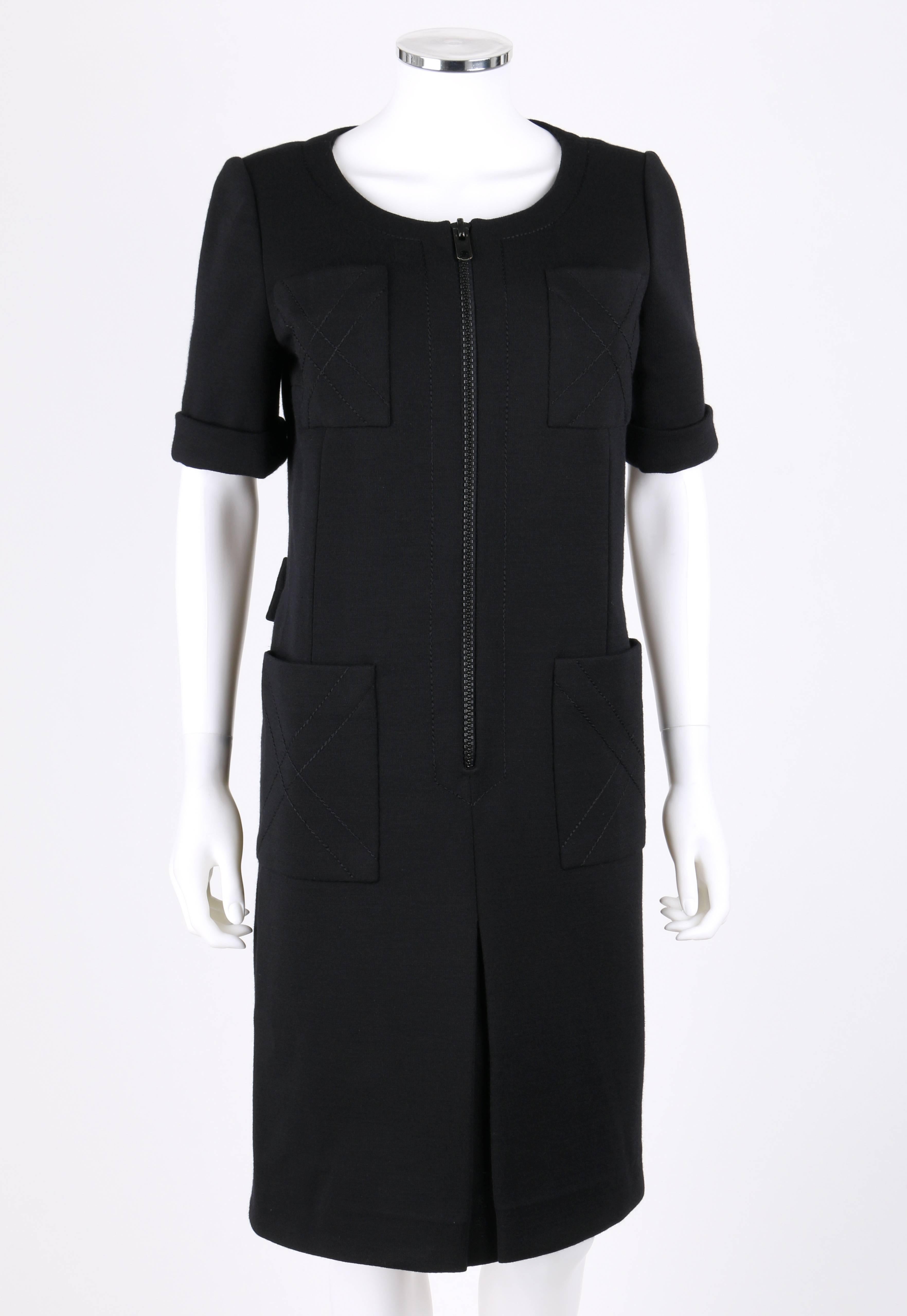 Vintage c.Early 1960's Jean Patou by Karl Lagerfeld black wool mod shift dress. Round neckline. Short sleeves with cuff detailing. Four large pockets, two on chest and two on hips, with 