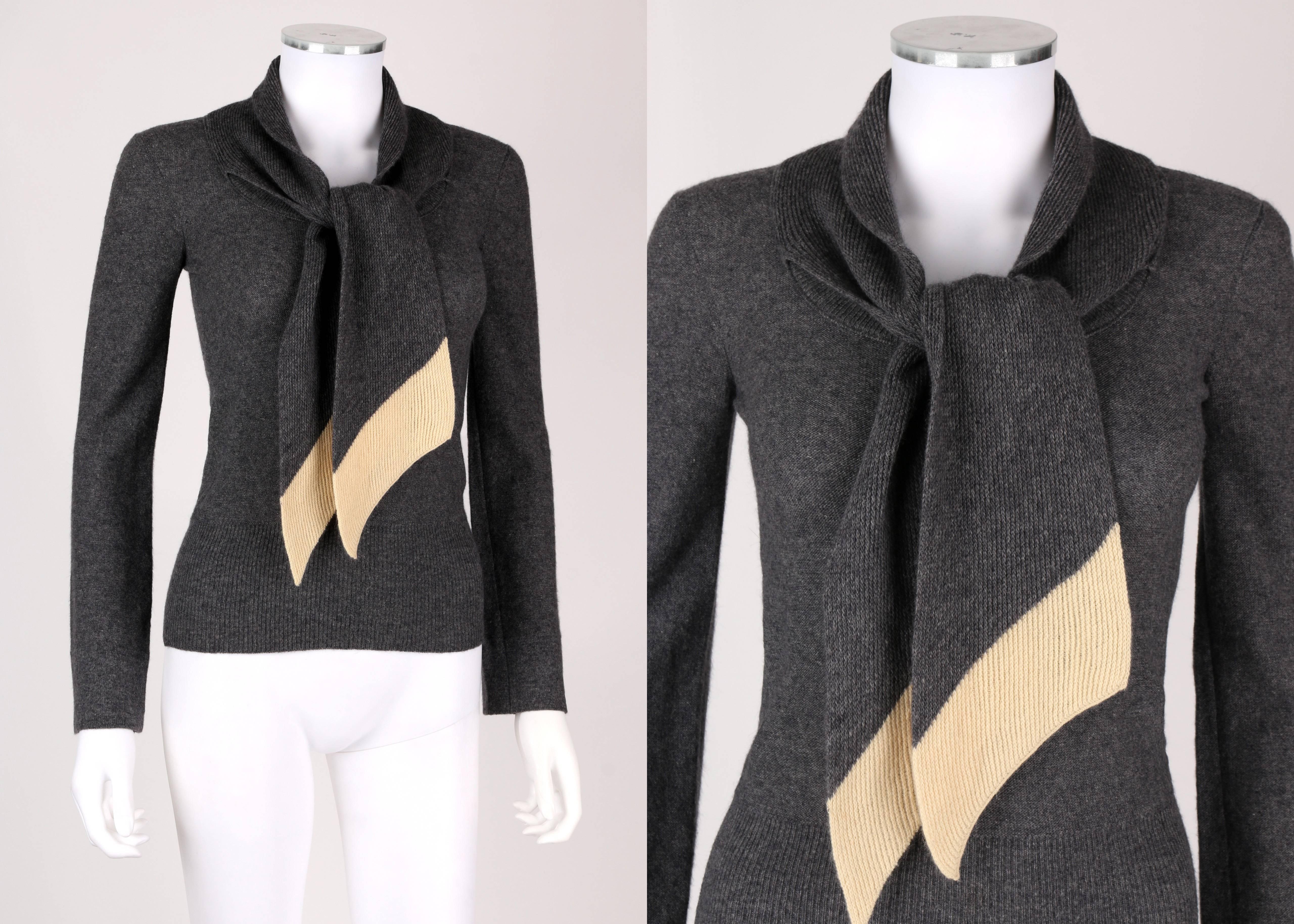 Early c.1960's Sonia Rykiel chez Henri Bendel gray knit pullover sweater. Scoop neckline. Attached scarf with cream hem detailing. Long sleeves. Wide ribbed waistband. Unmarked Fabric Content: Wool or wool blend. Marked Size: 