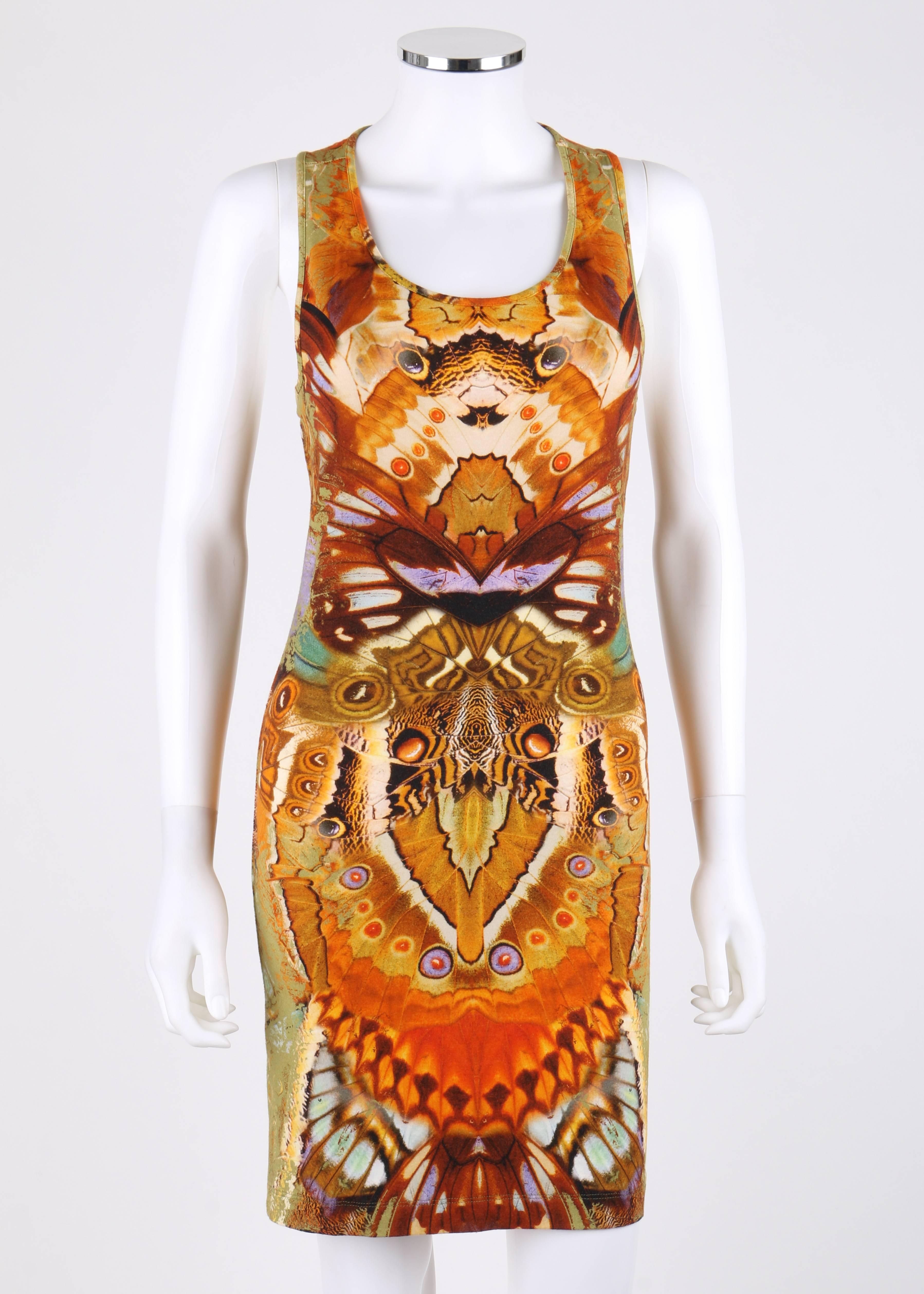 Alexander McQueen Spring 2010 moth camouflage print from the Plato's Atlantis collection tank dress. All over signature kaleidoscope moth camouflage print. Sleeveless. Scoop neckline. Racer back. Bodycon fit. Marked Fabric: 