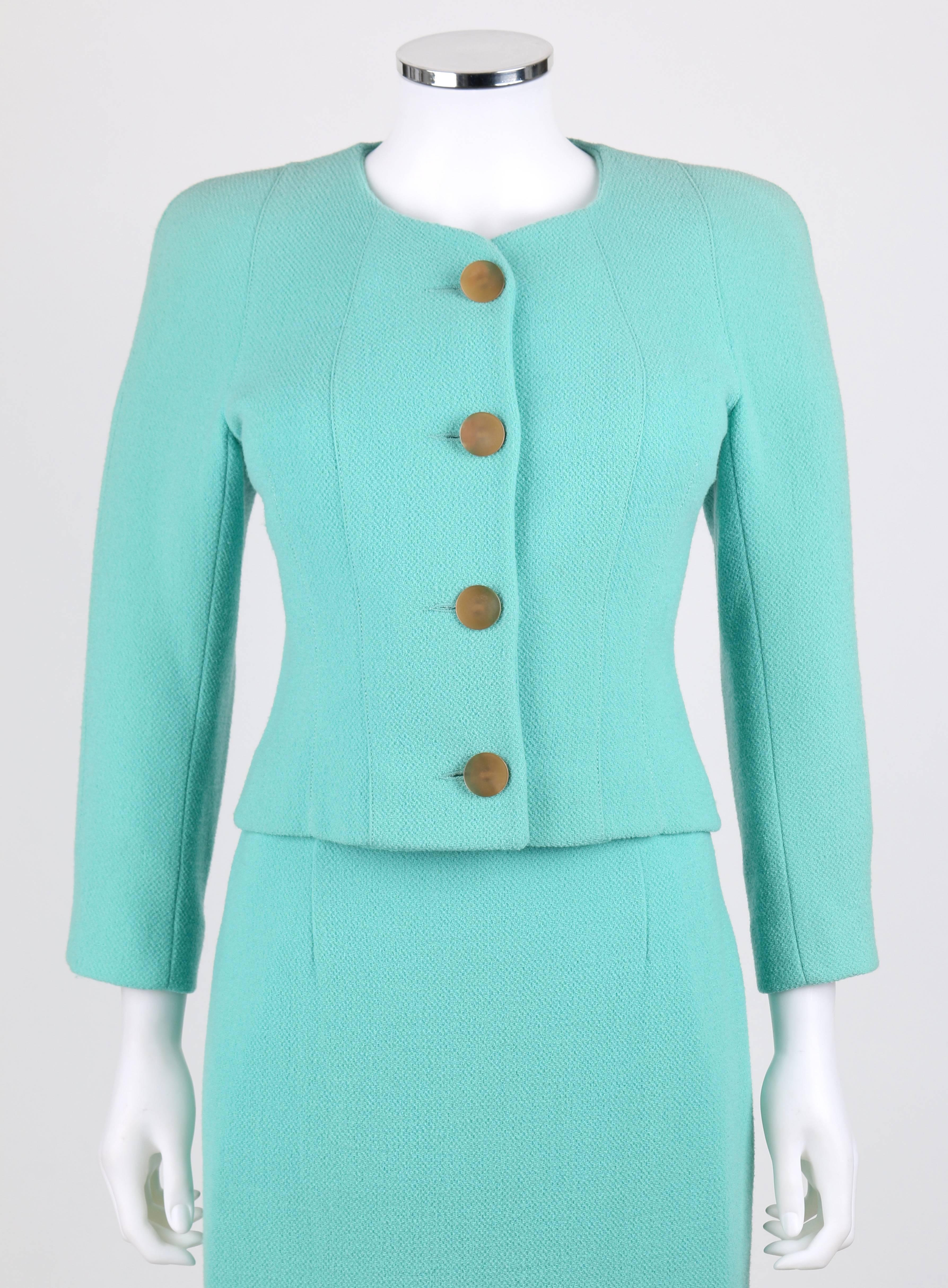Balenciaga Le Dix (designed by Michel Goma) two piece 1960's inspired sea foam green wool suit set from the Autumn / Winter 1991 collection. Blazer has high crew neck. Long sleeves. Four center front large pearlized tan button closures. Stylized