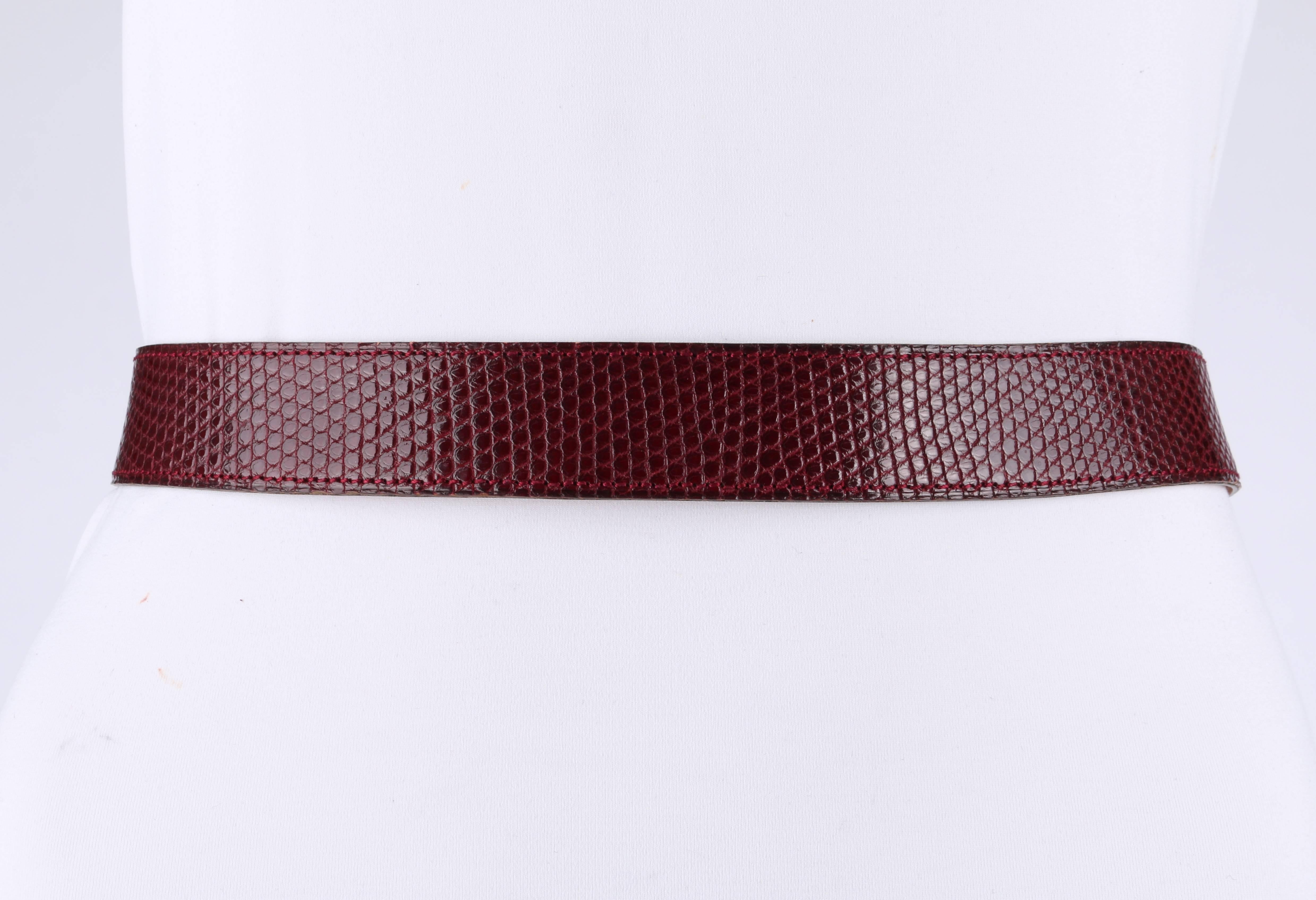 Hermes c.1980's Burgundy Lizard Skin Leather Equestrian Ring Belt Gold Hardware

Brand / Manufacturer: Hermes
Designer: Eric Bergere 
Circa: 1980's
Style: Belt
Color(s): Shades of burgundy and gold
Lined: No
Unmarked Fabric Content: Genuine leather
