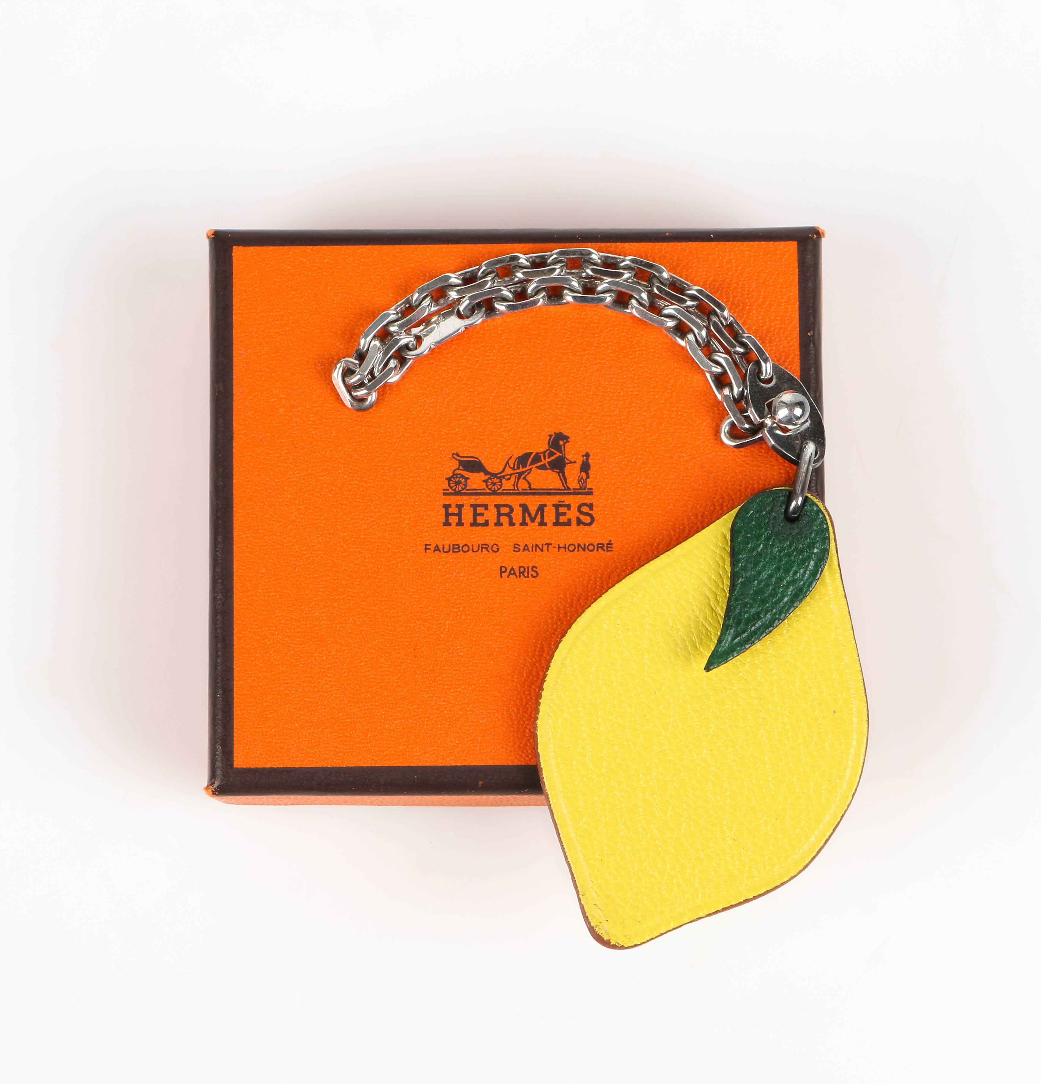 Hermes S/S 2005 leather lemon motif bag charm key chain. Sterling silver drawn cable chain. Hermes stamp on reverse side of leaf. Signed marking on chain. Marked Material: 