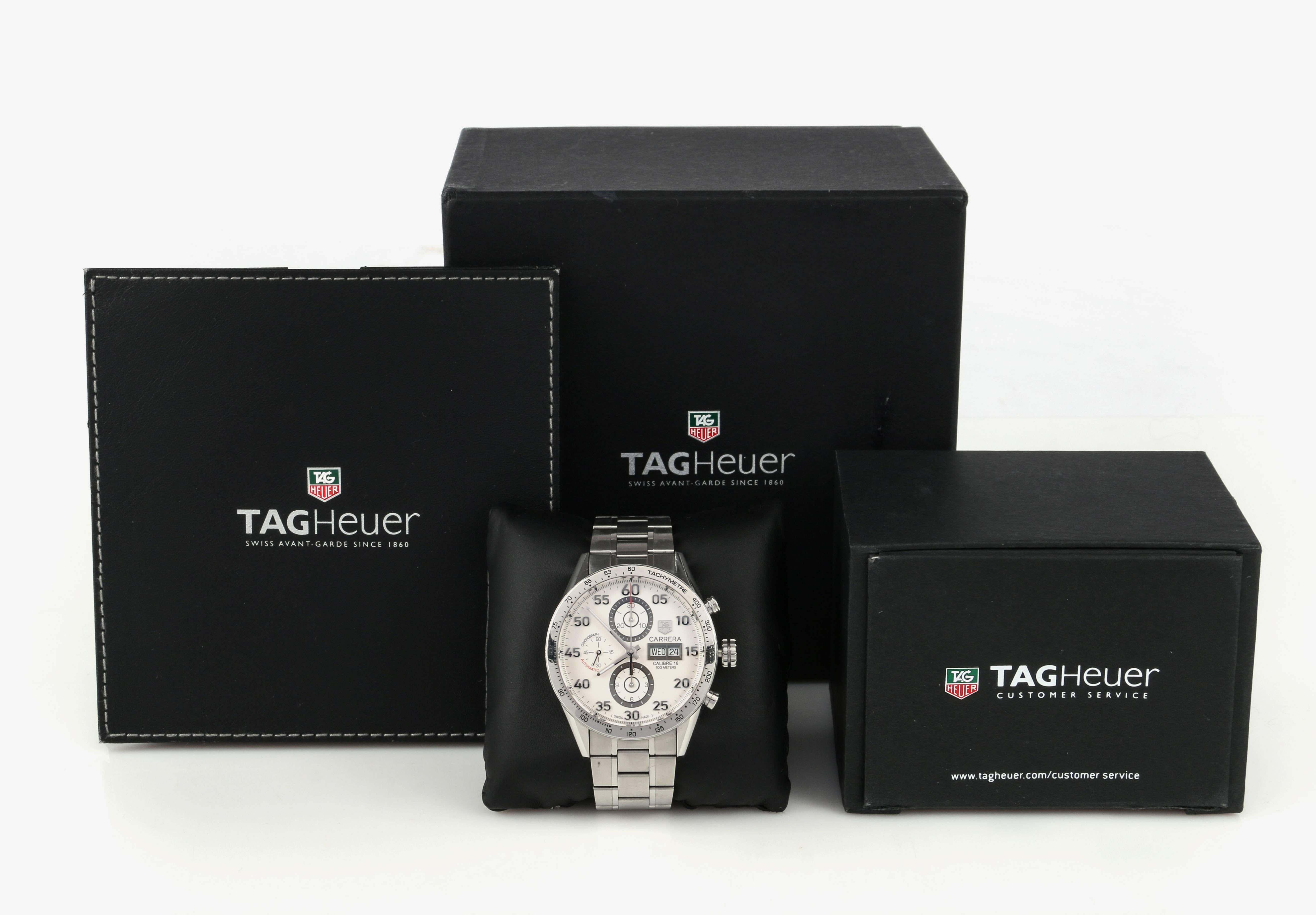 Tag Heuer Carrera Calibre 16 Automatic Chronograph 43 mm Stainless Steel watch. White dial features 3 sub dials, a day-date date window, and hour, minute and second hands. Dial is marked “Tag Heuer", "Carrera", "Calibre