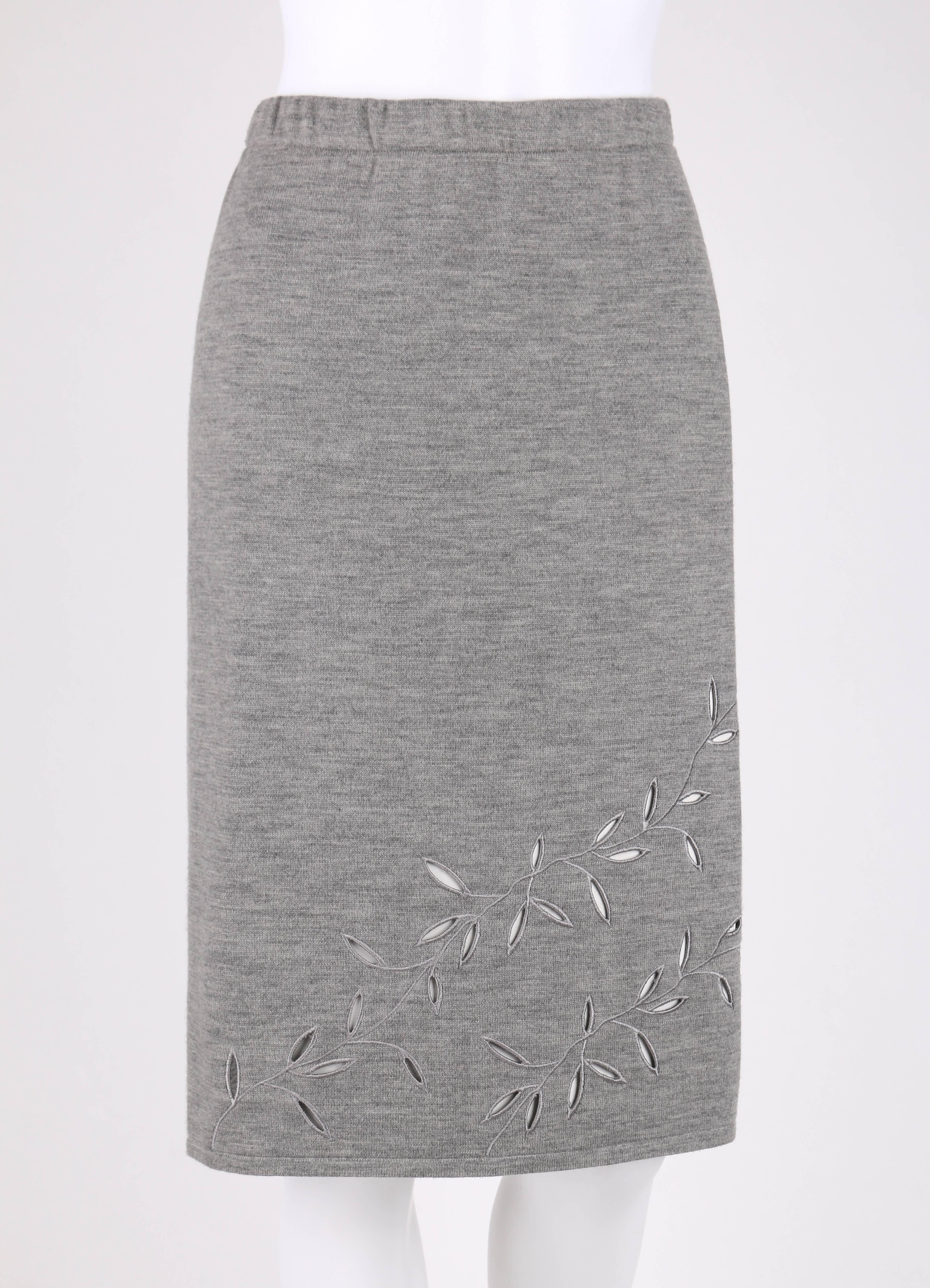 Givenchy Couture A/W 1998 designed by Alexander McQueen gray vine cut work pencil skirt. Light heather gray wool knit. Elastic waistband. Embroidered vine detail with cut out leafs. Unlined. Marked Fabric Content: 