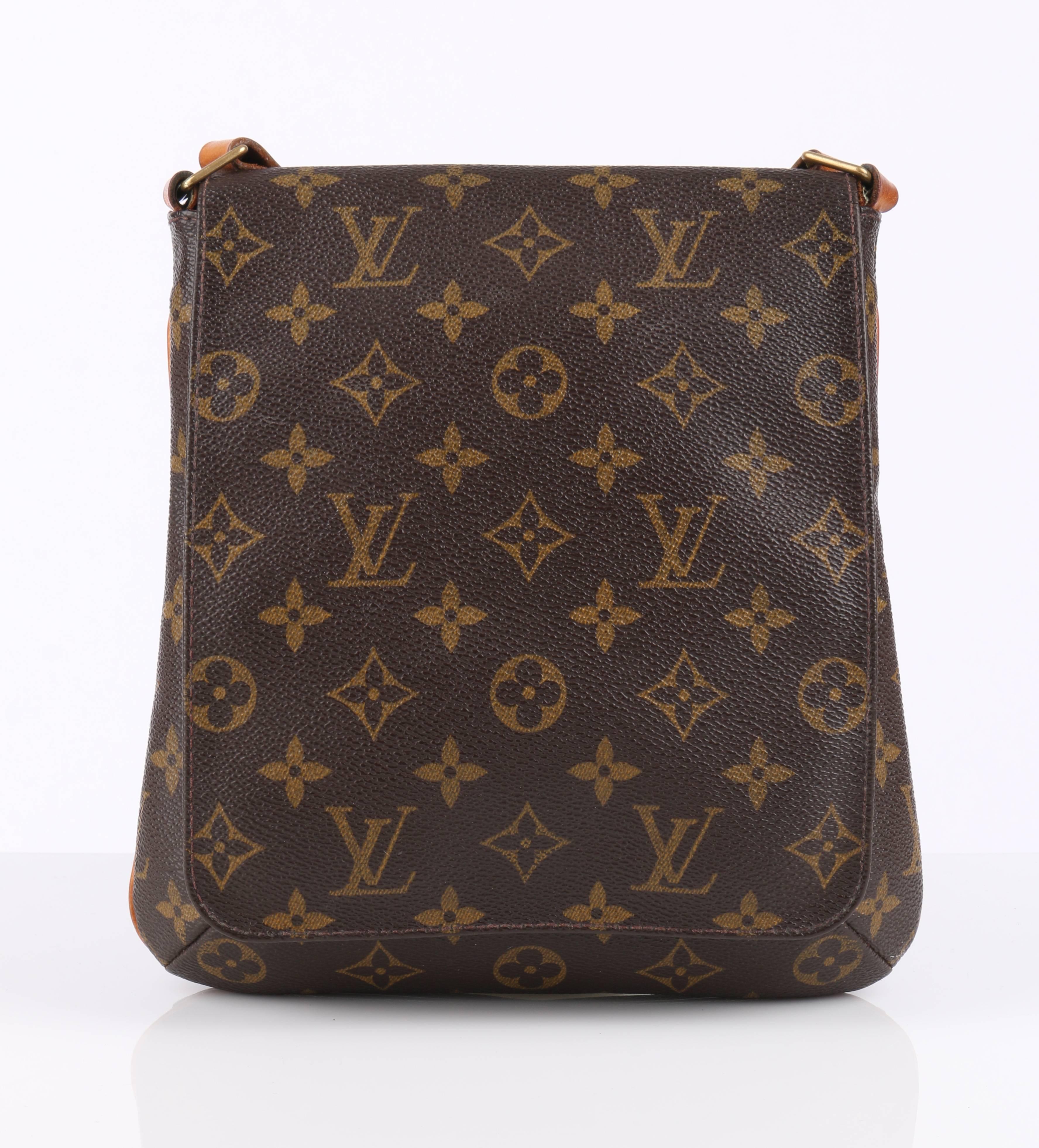 Louis Vuitton c.1998 monogram coated canvas "Musette Salsa" shoulder handbag. Front flap with magnetic snap button closure. Brown Alcantara interior lining. Open interior inset pocket. Adjustable vachetta leather strap and trim detail.