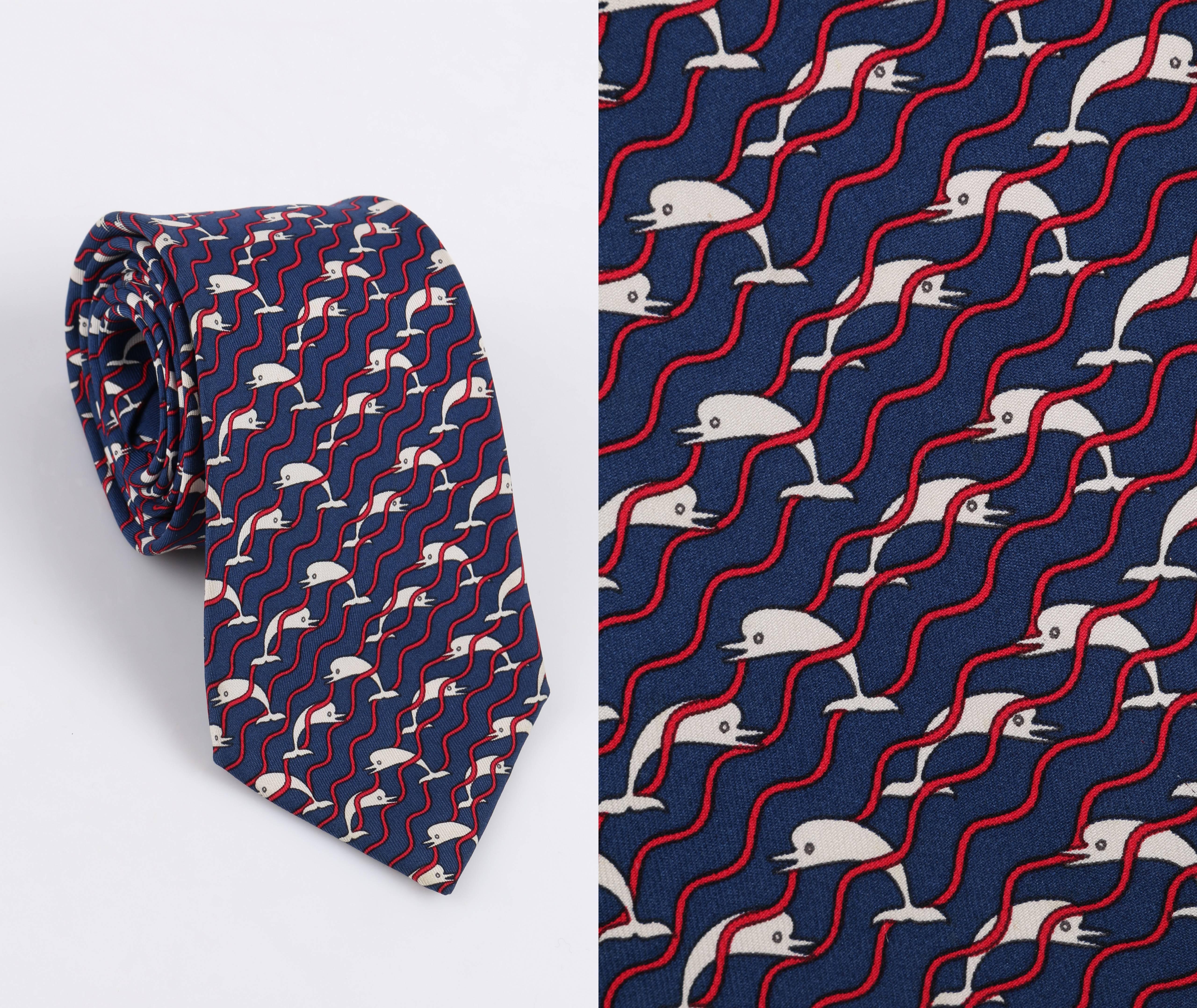 HERMES 5 Fold Navy Blue Dolphin Wave Stripe Print Silk Necktie Tie 987 SA

Brand / Manufacturer: Hermes
Manufacture Style Name: 987 SA
Style: 5 fold Necktie
Color(s):  Shades of blue, white, and red
Lined: Yes
Marked Fabric Content: 100% silk
Made