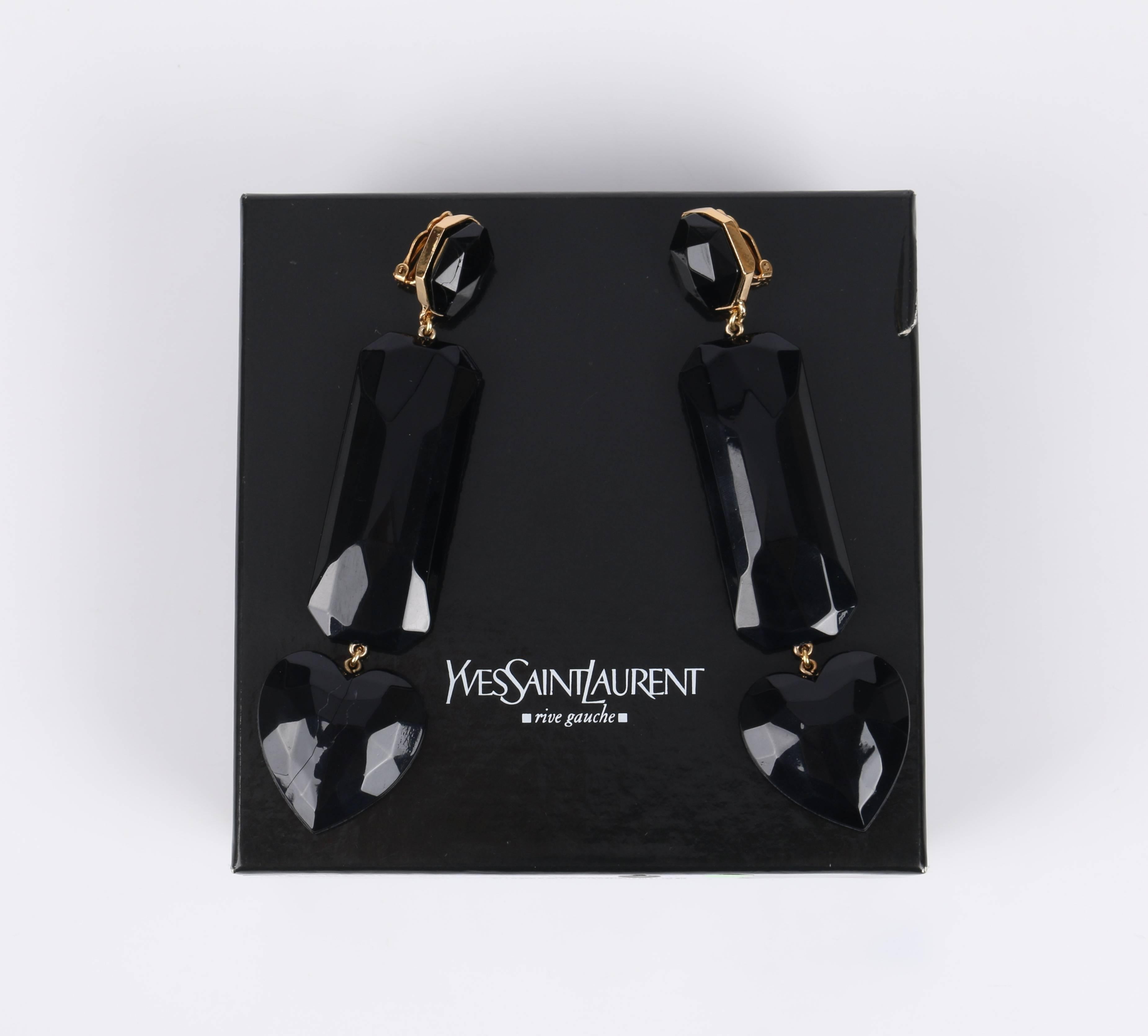 Yves Saint Laurent Rive Gauche black gem drop earrings. Large resin cast heart, rectangle, and octagon faceted gems. Gold-toned metal links and setting with clip on backing. Earrings are marked 