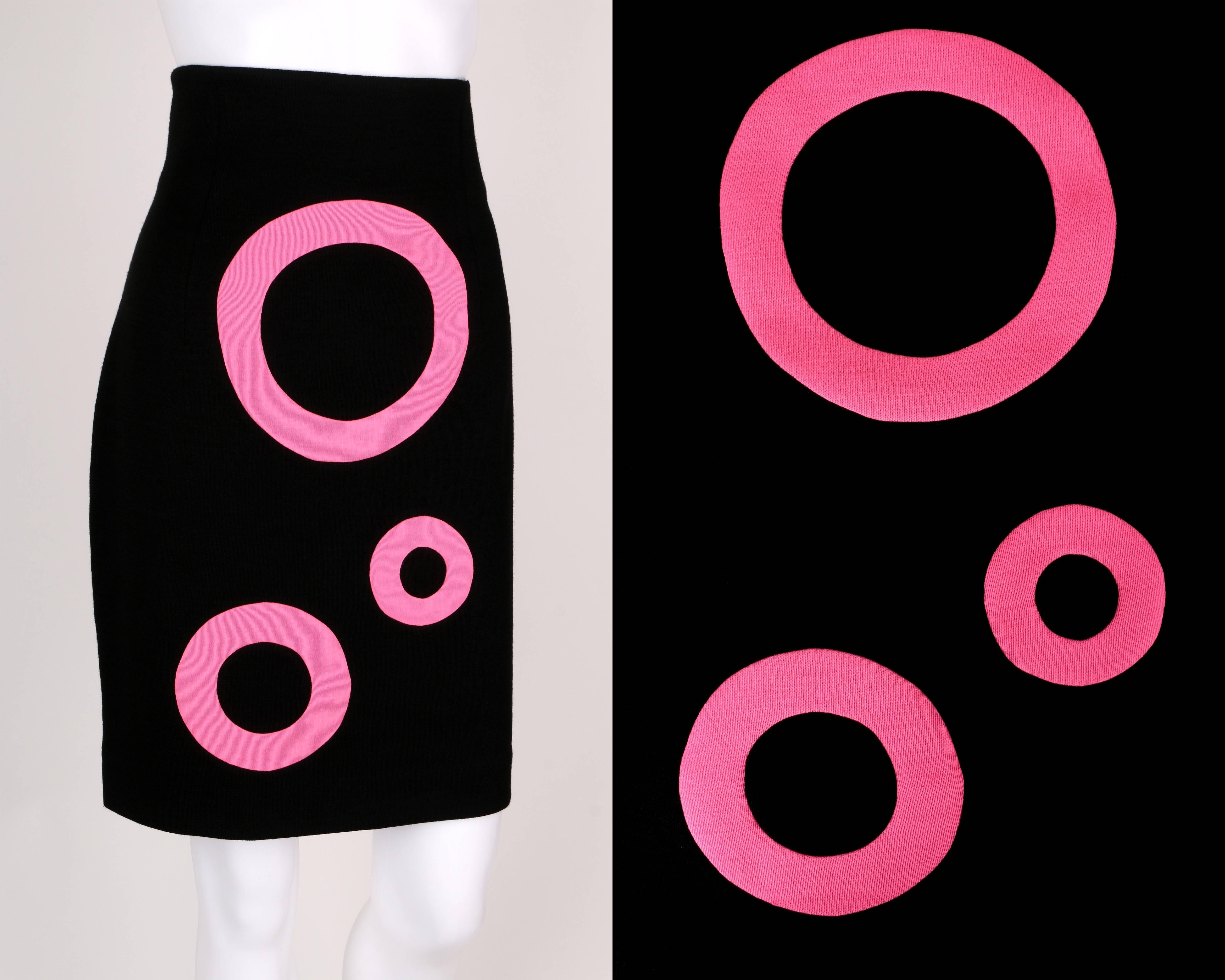 Junko Shimada black pink op art circle pencil skirt. High waisted. Waistline darts. Side invisible zipper closure. Fully lined. Please note that this item was clipped to better fit our mannequin for photographs. Marked Fabric Content: "70%