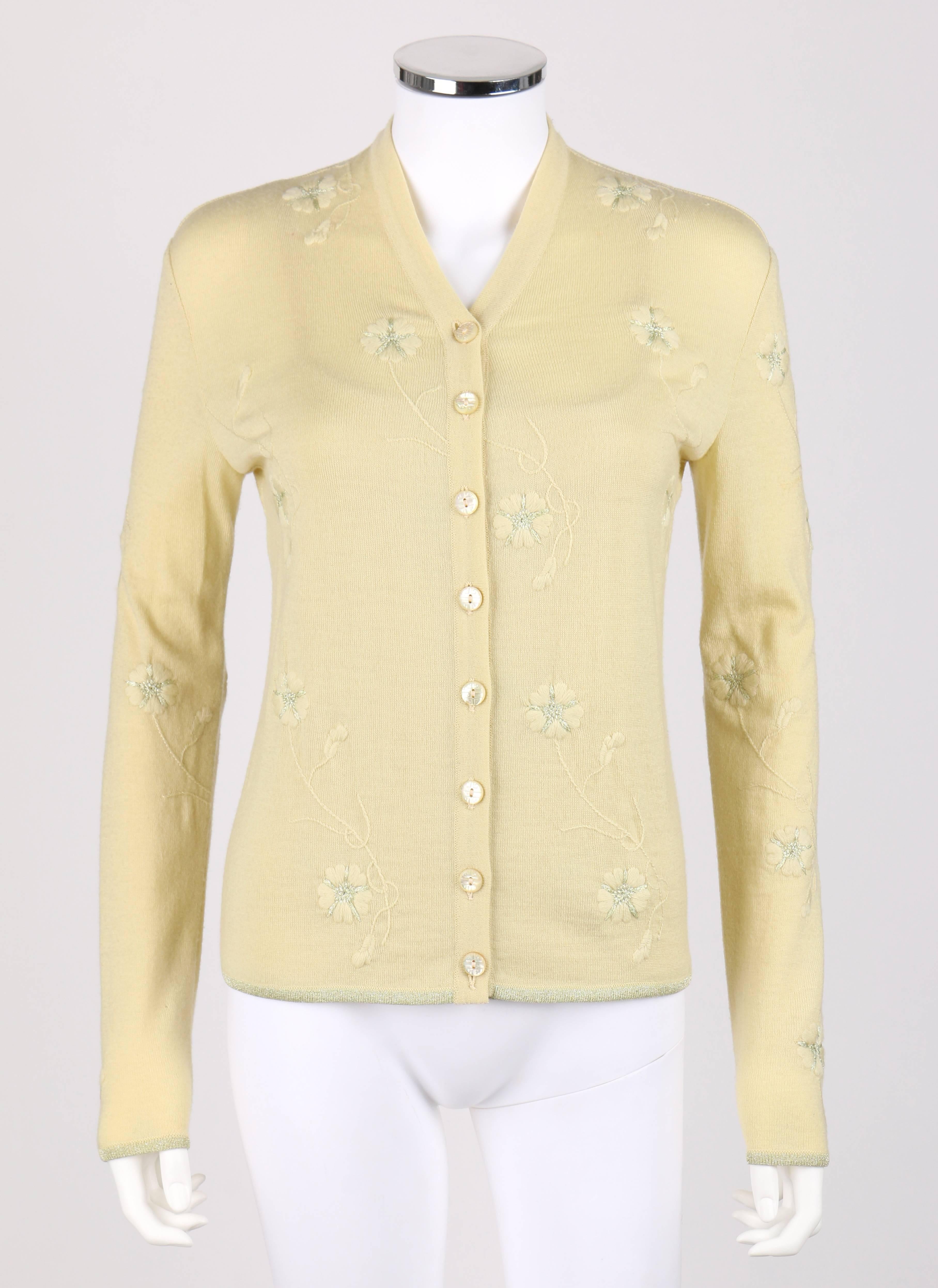 Givenchy Couture S/S 1998 designed by Alexander McQueen pale yellow cardigan tank top set. Pale yellow and metallic floral embroidered knit. Eight center front button closures. Round pearlescent yellow buttons with etched Givenchy logo. V-neckline.