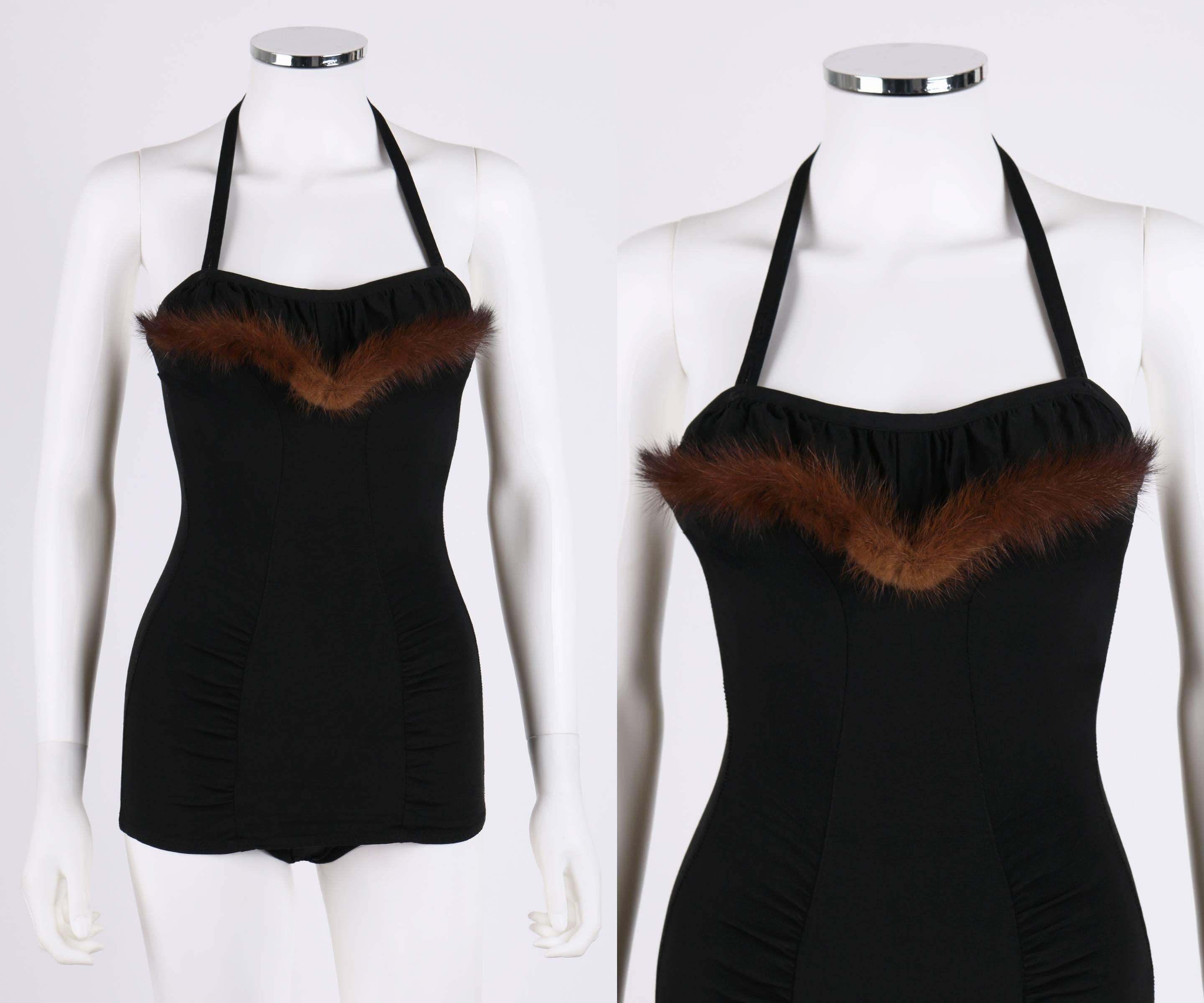 Vintage c.1950's PinUp black one piece bathing suit. Thin adjustable halter strap with two button closures. Ruched sweetheart neckline with mink fur trim. Ruching at side front near hips. Metal zipper closure in back with single loop and button