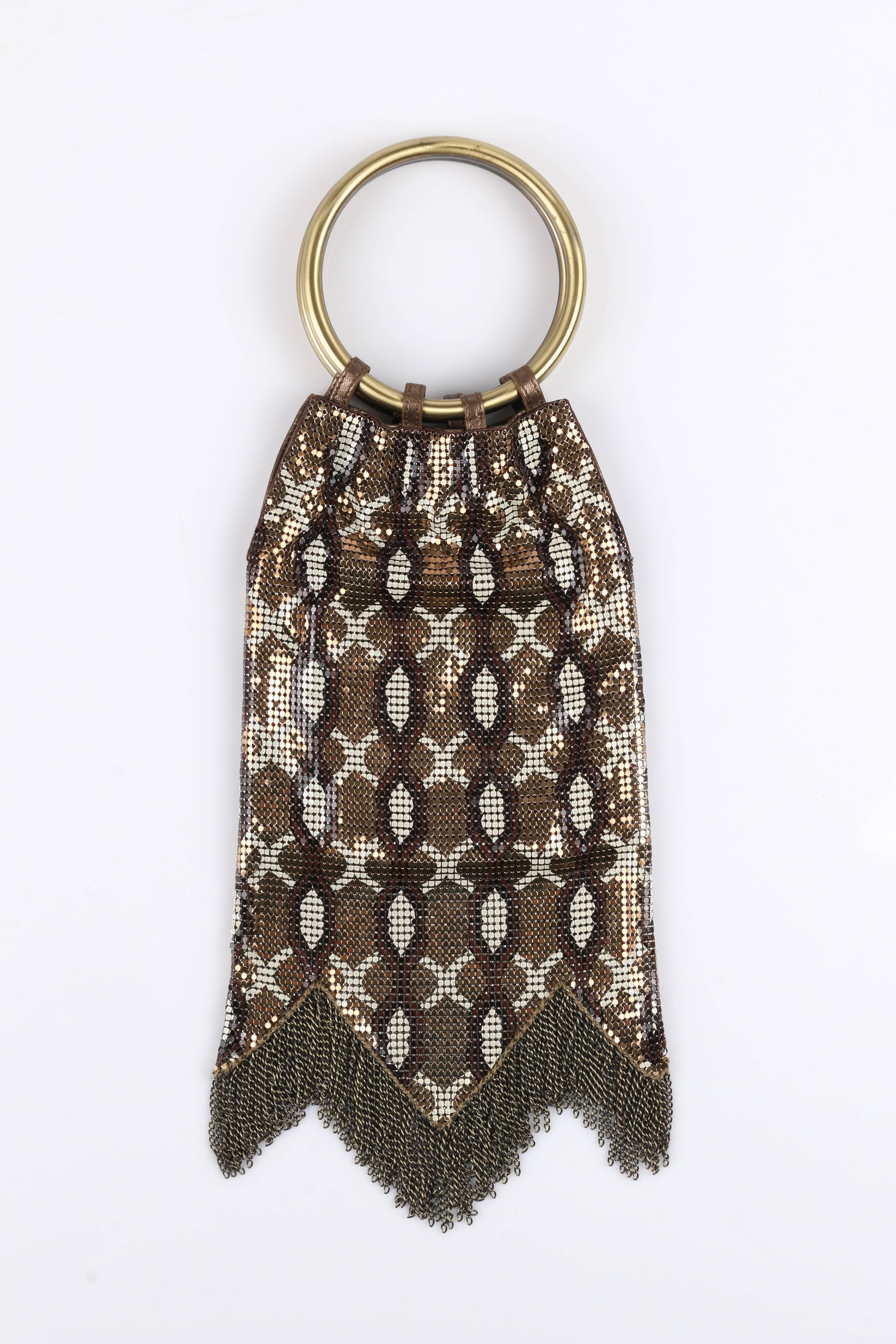 Rare Whiting & Davis metal mesh evening bag. Gold, brown, and ivory snake print metal mesh. Shark tooth hem with brushed gold curb chain fringe. Two gold metal ring handles. Hidden magnetic snap closure. Metallic bronze leather trim. Whiting
