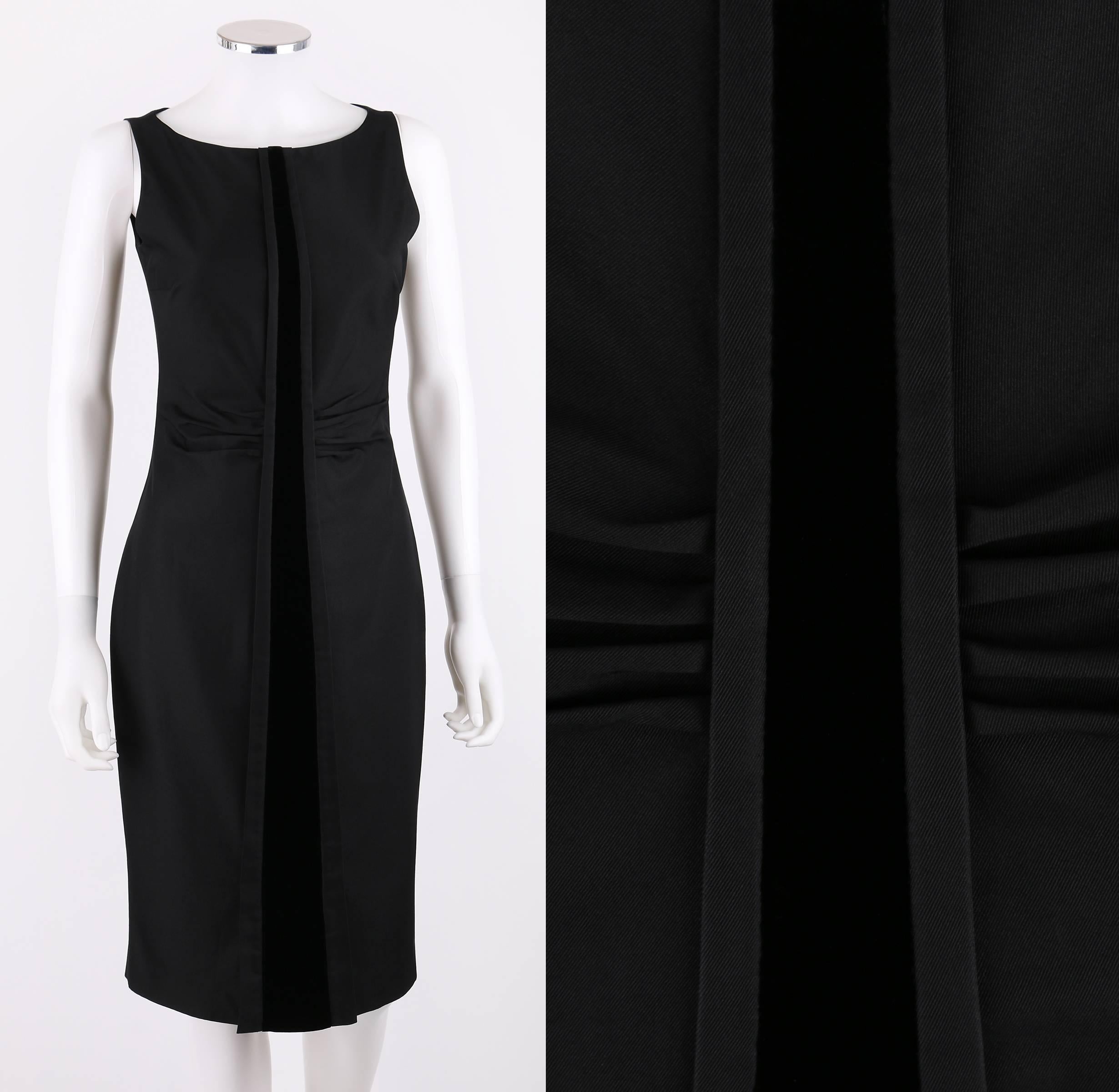Gucci A/W 2004 black sheath dress designed by Tom Ford. Bateau neckline. Sleeveless. Front box pleat detail at waist. Center front and back velvet panel. Two front and back vents. Side seam zipper with hook and eye closure at top. Fully lined.