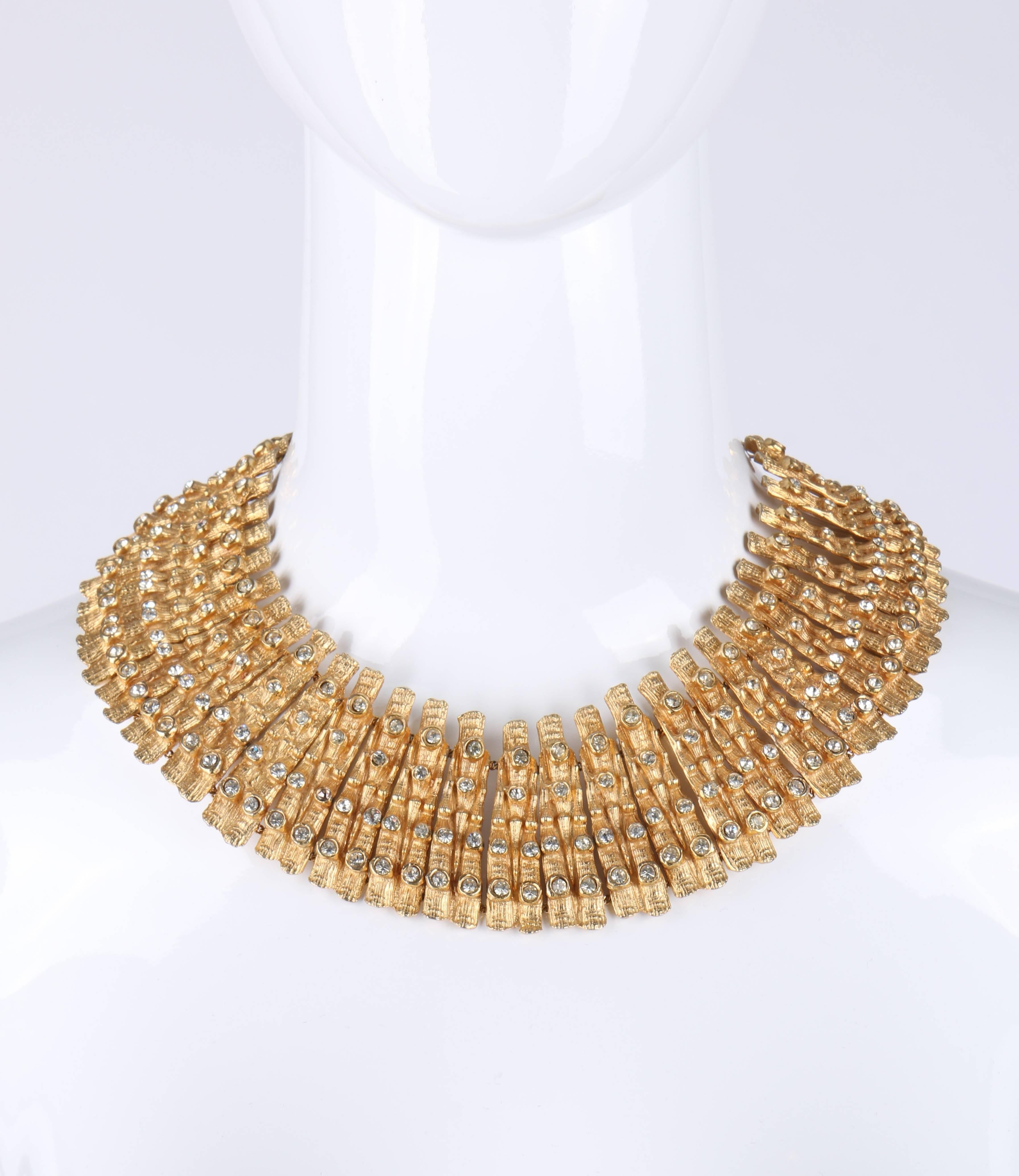 Vintage Mosell c.1950's Egyptian revival collar necklace and earrings set. Huge statement gold tone collar necklace. Carved bamboo design links with 4 round bezel set faceted clear rhinestones in a vertical row on each. J hook clasp closure.