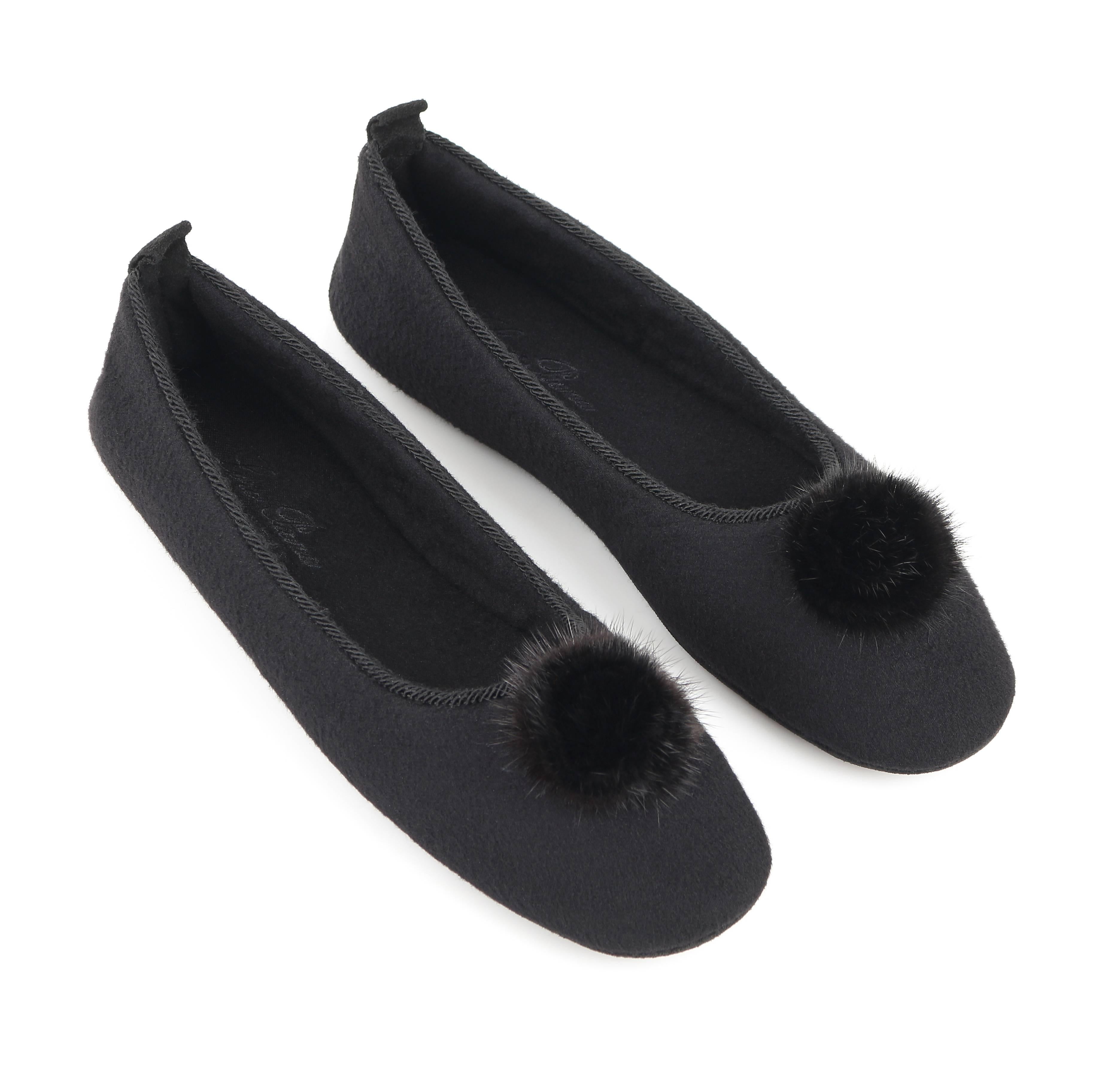 Loro Piana "Odette" black cashmere ballerina slippers. Black genuine mink pompom detail at toe. Black twisted rope detail along opening. Suede leather pull tab at back. Slip-on style. Original dust bag is included. Unmarked Material: