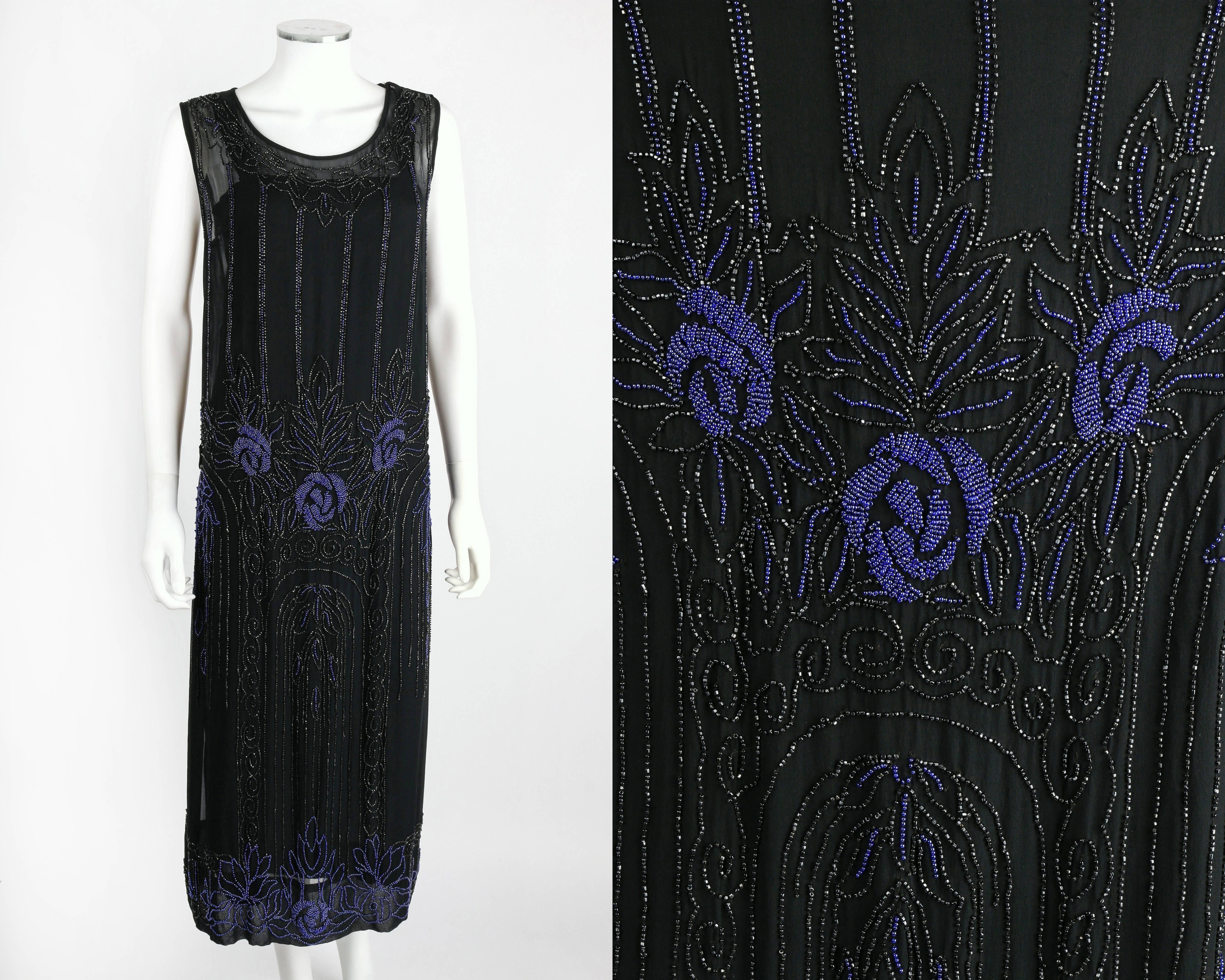 Vintage Couture c.1920's black silk chiffon cocktail dress with slip. Black sheer silk chiffon with black and purple-blue floral art deco design. Sleeveless. Scoop neckline. Four side seam knife pleats at dropped waistline. Slip on style. Three snap