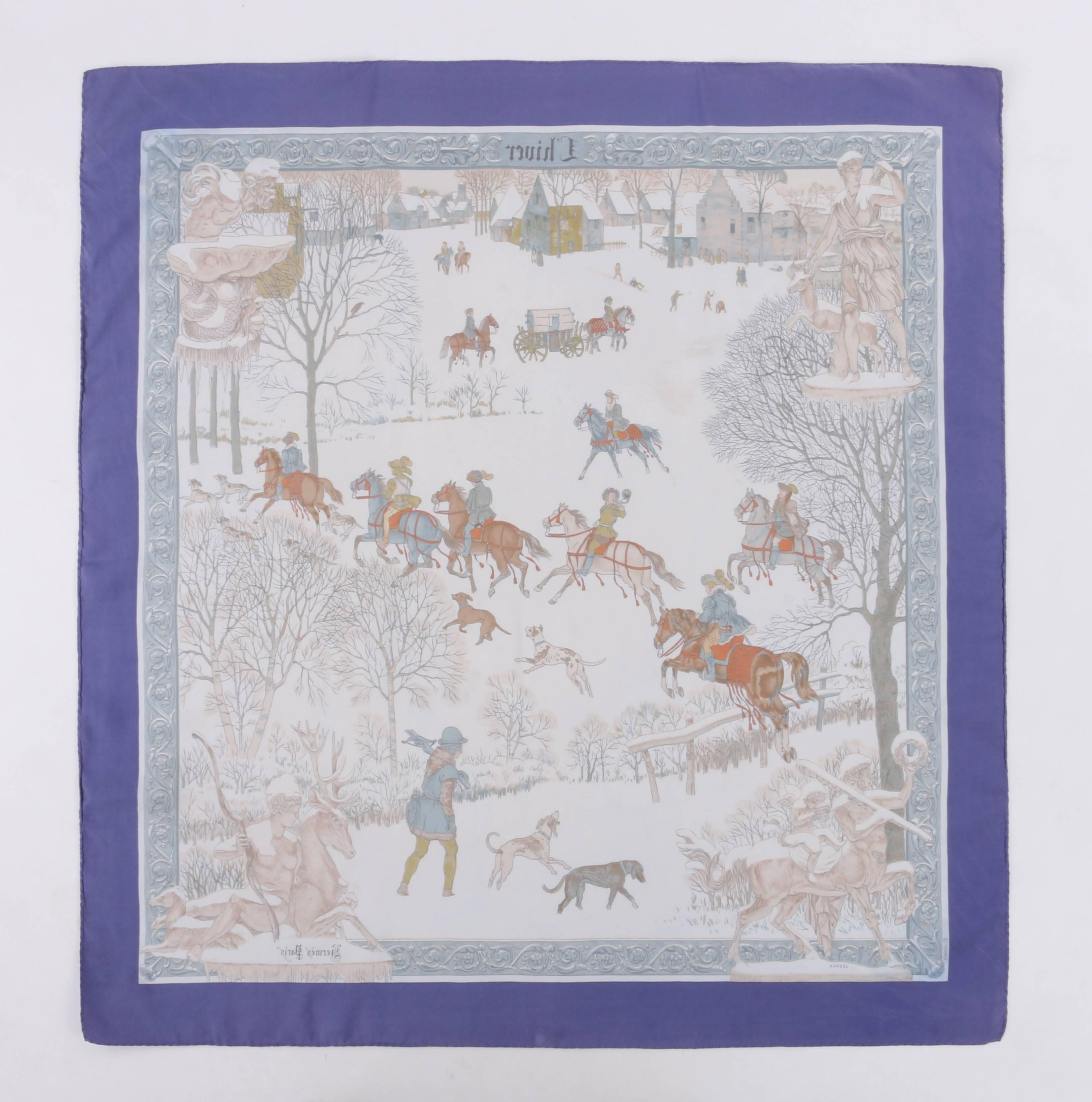 Vintage Hermes c.1968 "L'hiver" designed by Philippe Ledoux silk scarf. Purple and pale blue floral filigree boarder. Winter hunting scene motif on a winter white / off white background. Greek statuary printed at each corner.