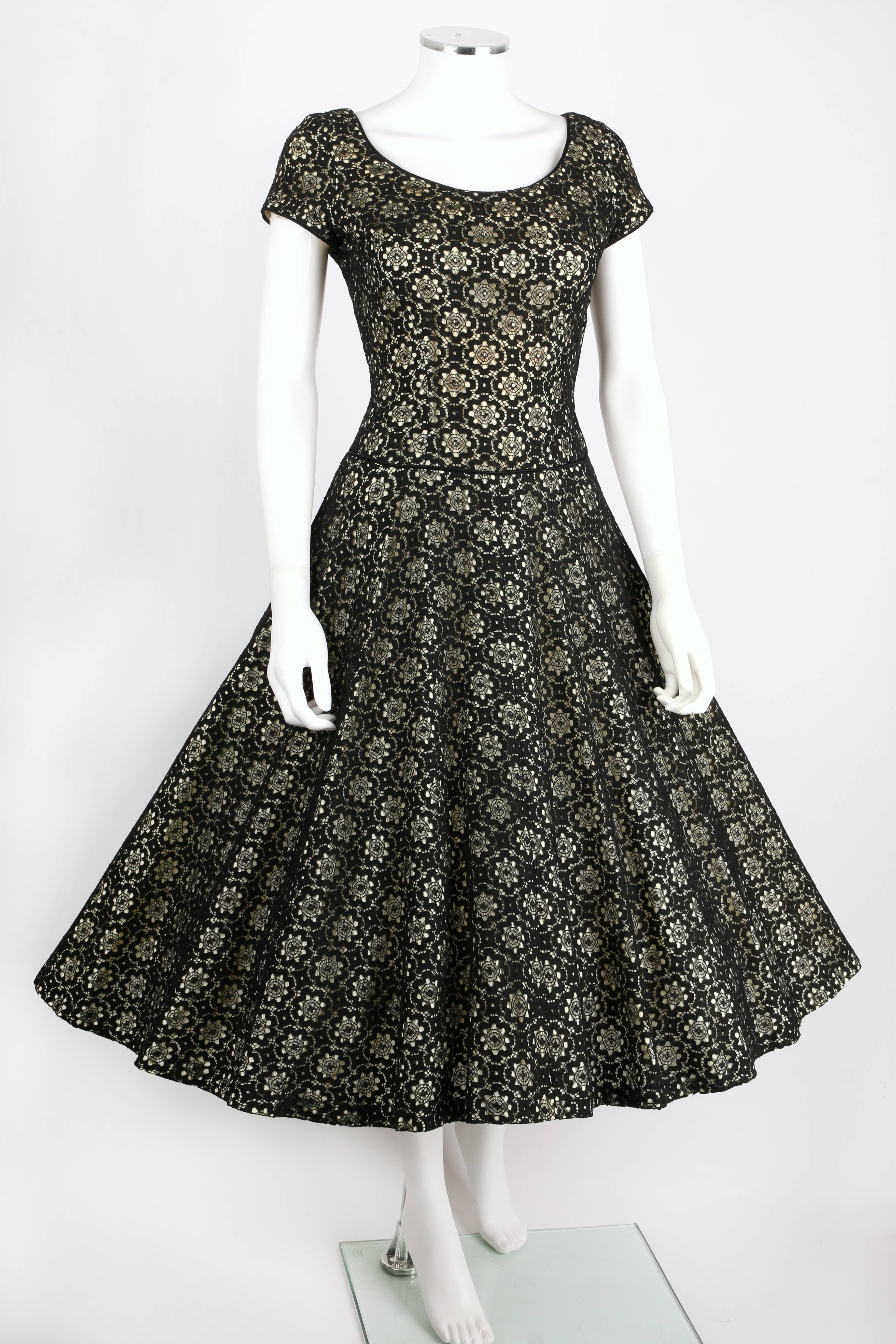 Miss Jane Junior Original c.1950's classic vintage black floral lace party dress. Black floral lace laid over winter white. Cap sleeves. Scoop neckline at front and back. Bodice is embellished with rhinestones. Black piping detail at neckline and
