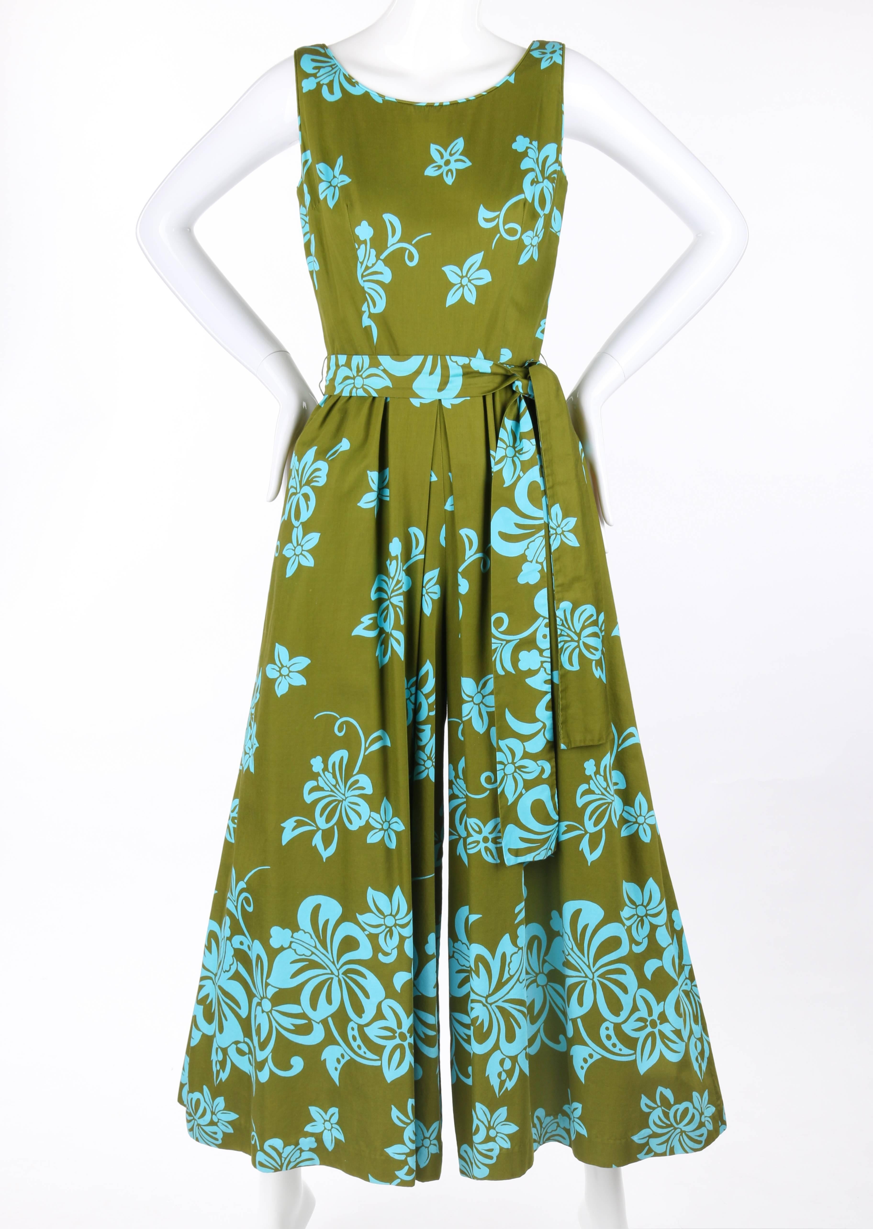 Vintage Waltah Clarke's Hawaiian Shop c.1960's floral jumpsuit. Olive green with turquoise tropical floral print. Sleeveless. Scoop neckline with low back. Gathered waistline with center front and back inverted box pleat. Wide palazzo style legs.