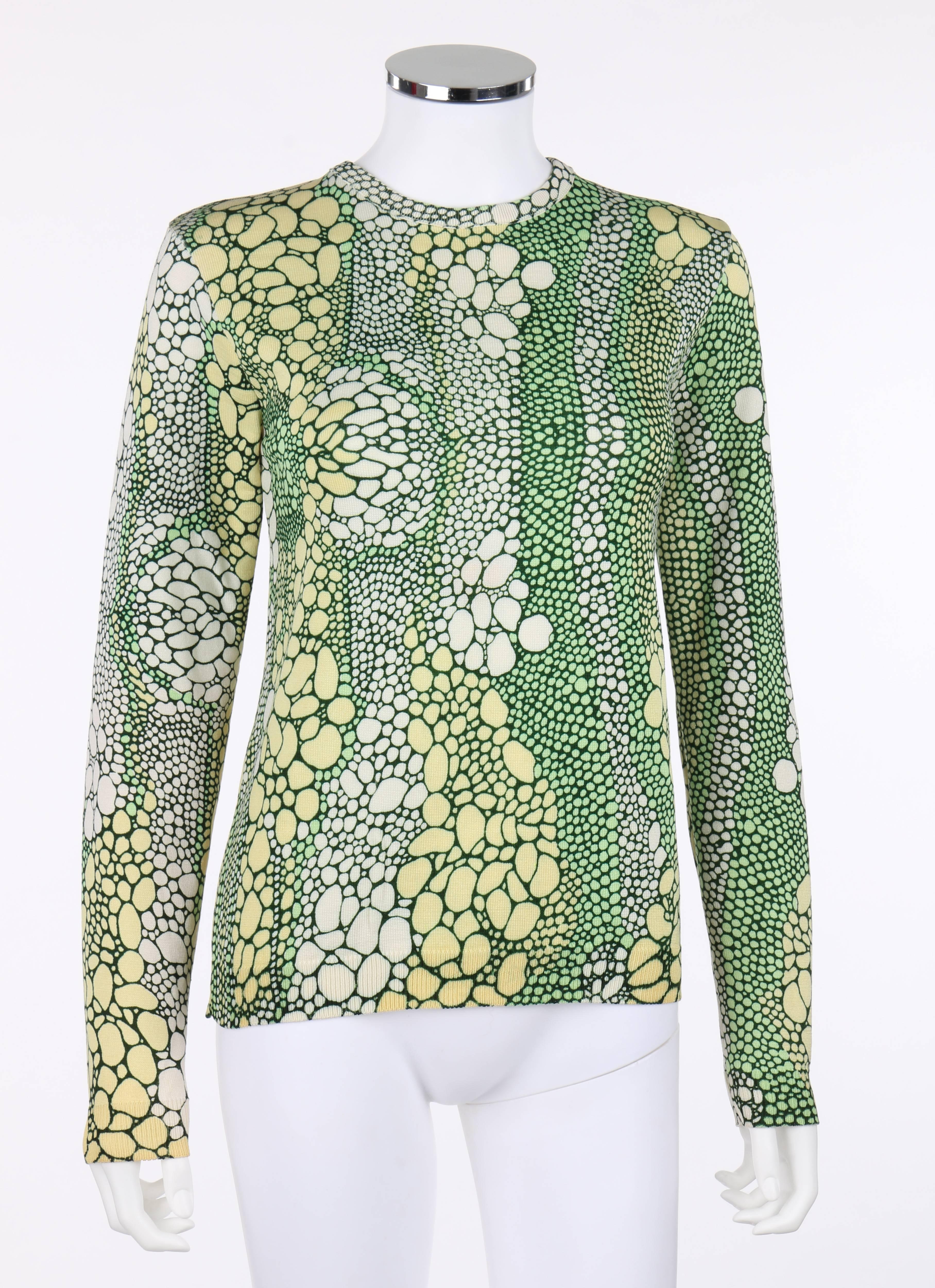 Vintage Givenchy Sport c.1970's green mutlicolor reptile print top. All over reptile print in shades of cream, light yellow, and green. Crew neckline. Long sleeves. Rib knit trim around collar, cuffs, and hemline. Pull over style. Unmarked Fabric