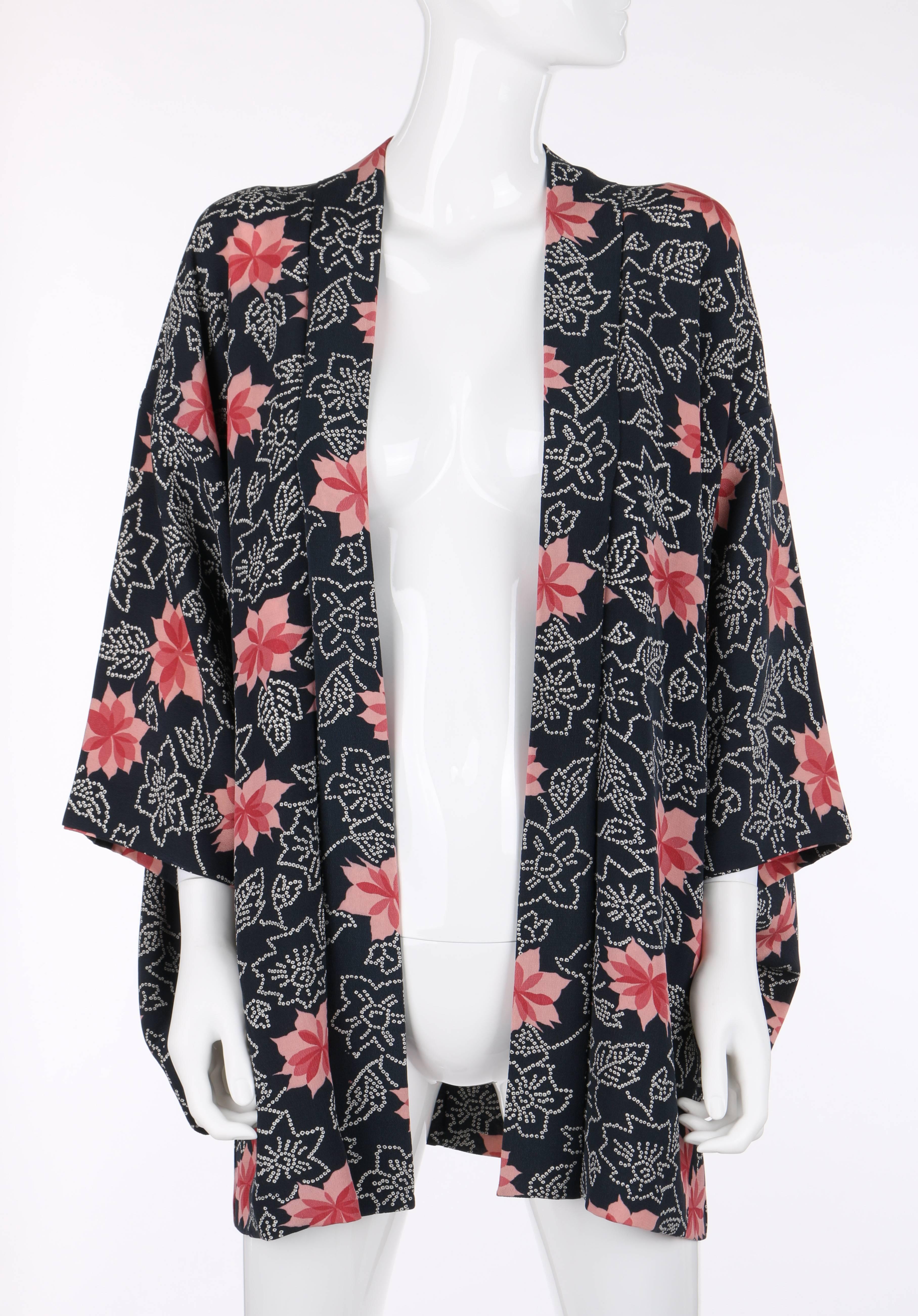 Vintage one-of-a-kind c.1940's floral rayon crepe haori. Midnight blue with white and pink all over floral water lily print. Full kimono sleeves. Matching eri collar. Partially lined in winter white floral print lining. Two interior loops for ties.