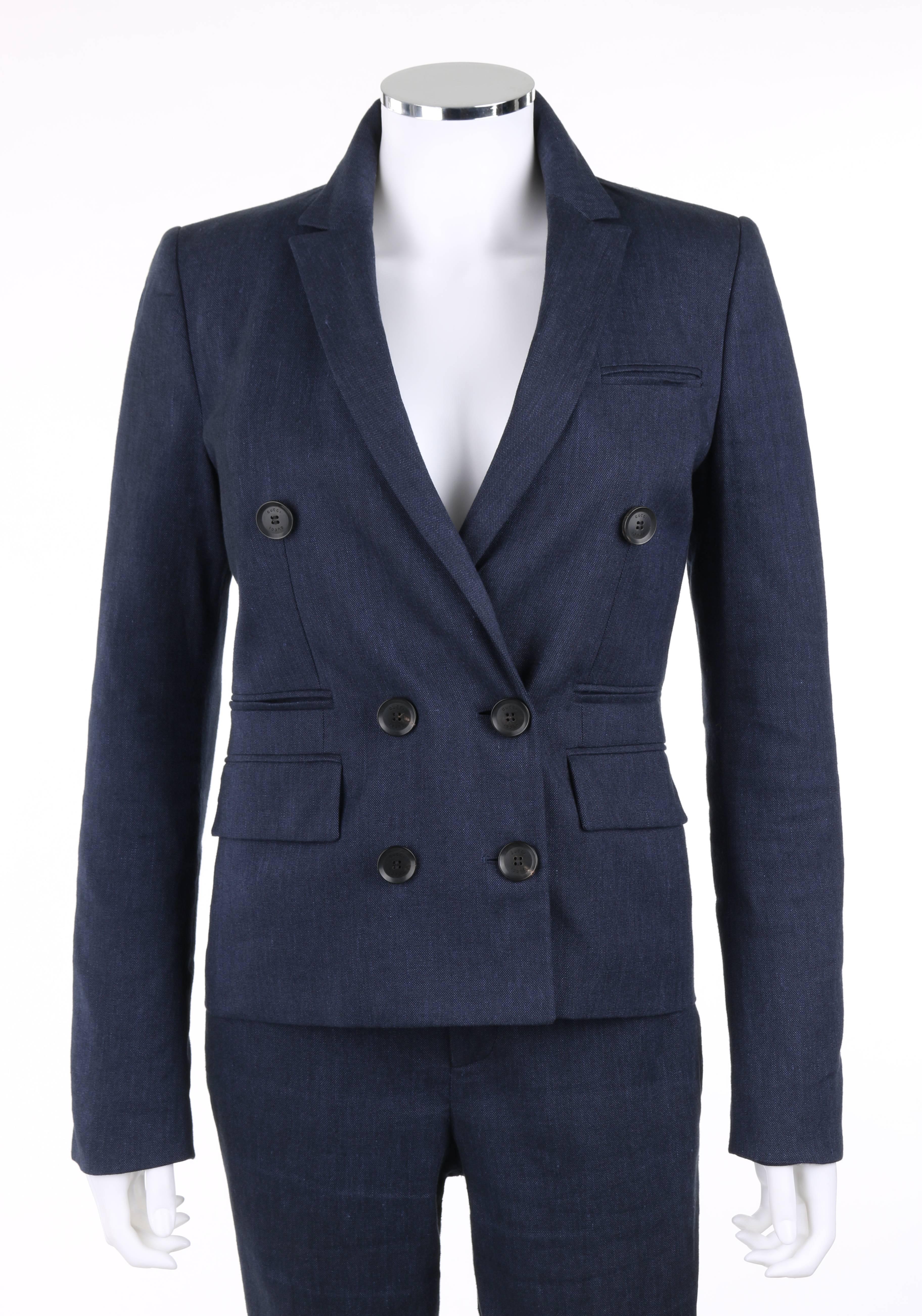 Gucci Pre-Fall 2014 2 Piece dark blue linen blend pants suit. Double breasted jacket. Long sleeves with four mock button closures at cuff. Six front buttons with two exterior and single interior button closures. Notched lapel collar. Two double welt