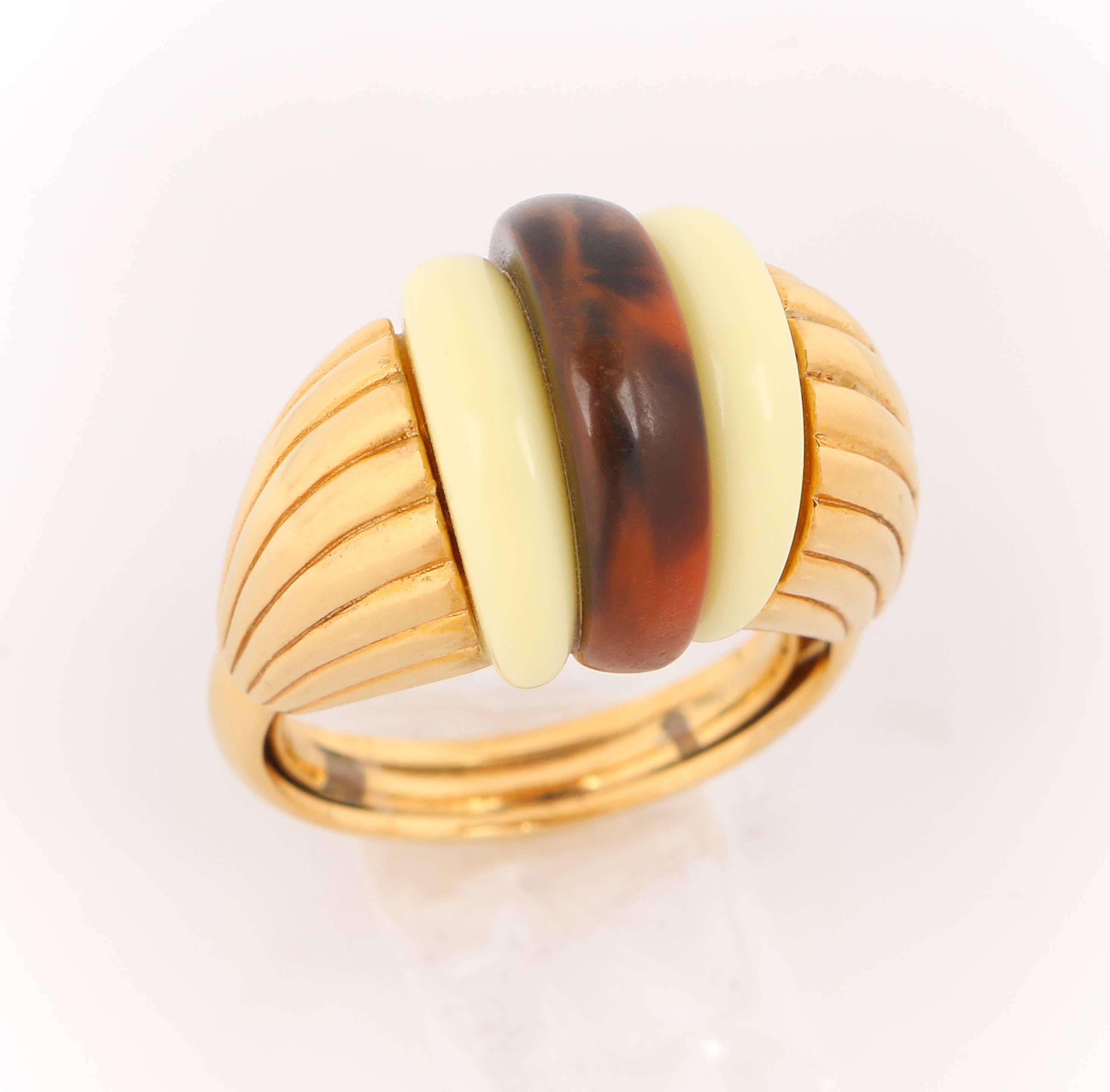 Vintage Lanvin c.1970's gold art deco styled dome ring. Plastic ivory and brown tortoiseshell thin domed center stones. Gold ridged clam shell setting. Thin gold band with interior prongs for size adjustment. Marked: "Lanvin". Unmarked