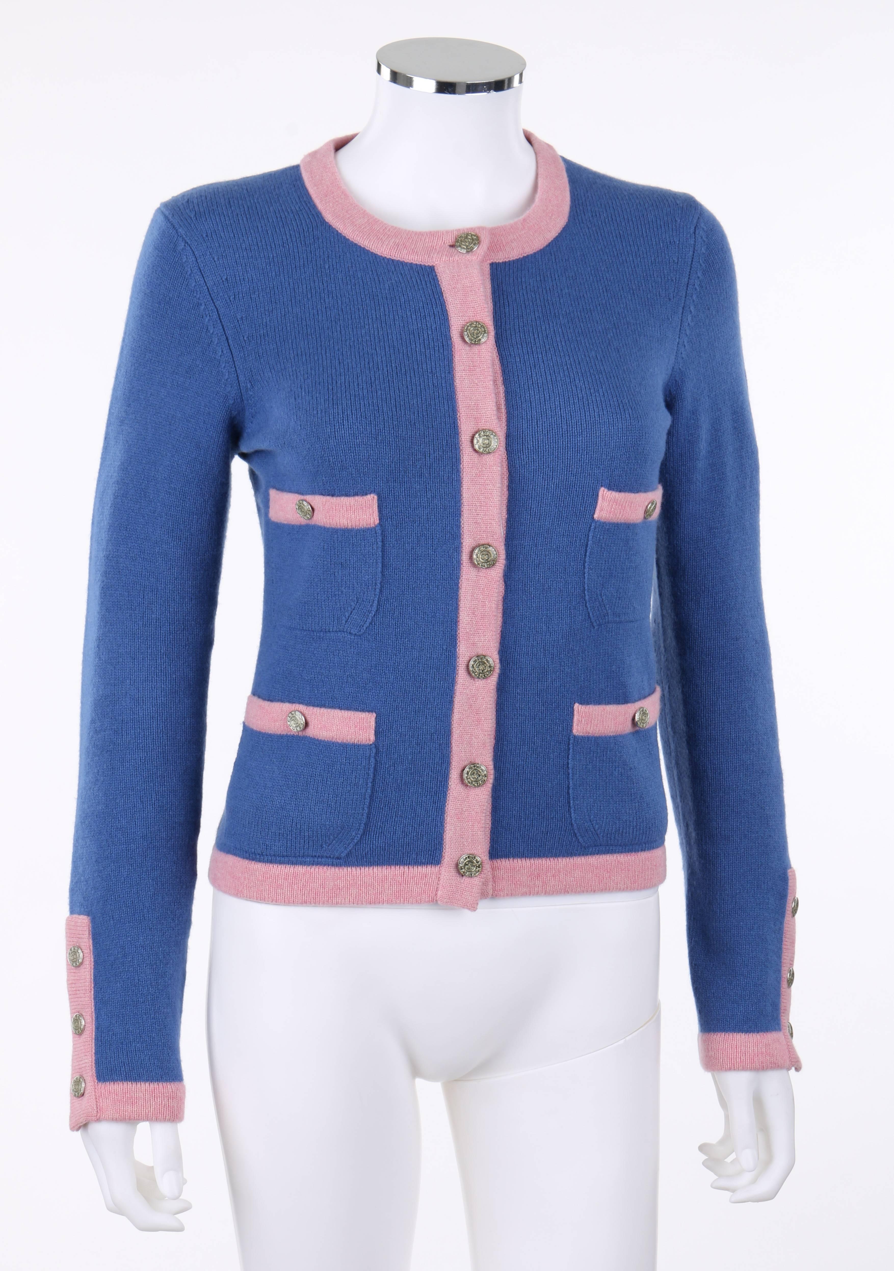 Chanel Spring/Summer 2013 dark blue & pink bi-color classic cardigan. Featured in Chanel's 'The Making of the Cardigan' video. Scoop neckline. Silver-toned "CC" and star round buttons. Long sleeves with three button closures at cuff.