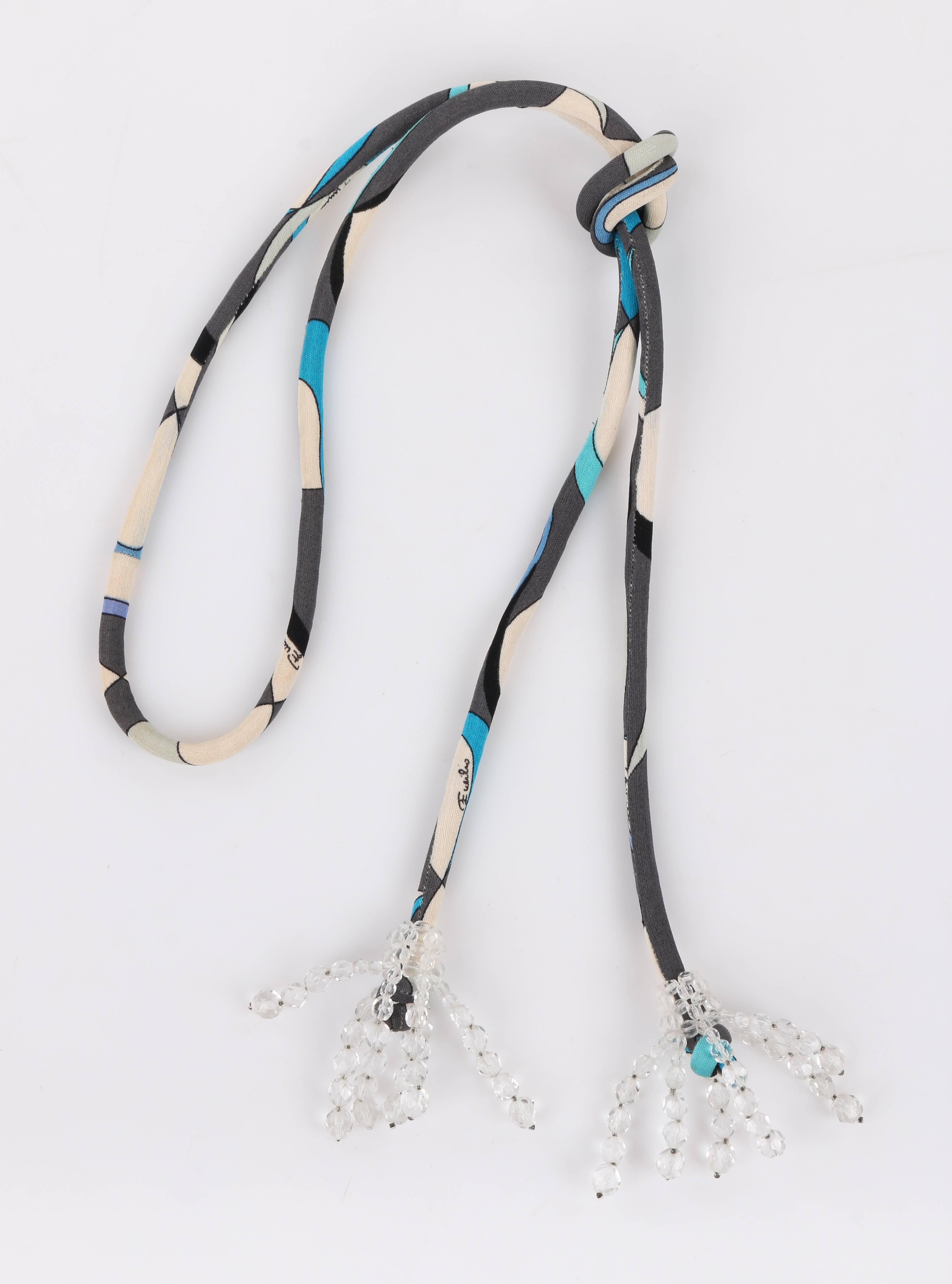 Vintage Emilio Pucci c.1960's multi-color signature print rope belt / lariat necklace designed by Coppola e Toppo. Thin silk jersey abstract signature print in shades of blue, white, and gray. Thin fabric body with knotted ends. Clear faceted