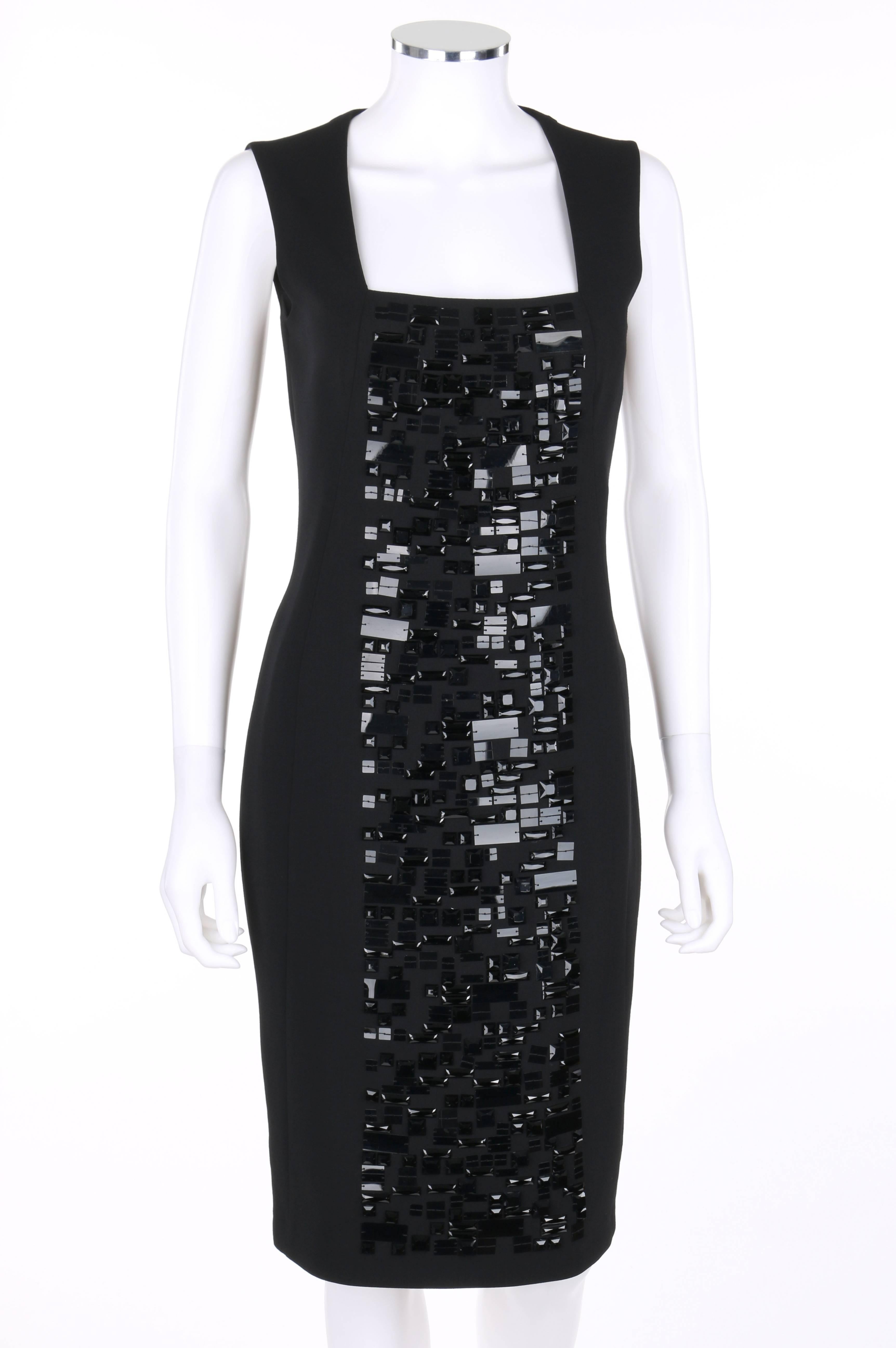 Akris Pre-Fall 2011 black wool sheath style cocktail dress. Center front panel embellished with black square and rectangular sequins and faceted rhinestones. Square neckline. Princess seamed. Center back invisible zipper. Fully lined. Marked Fabric