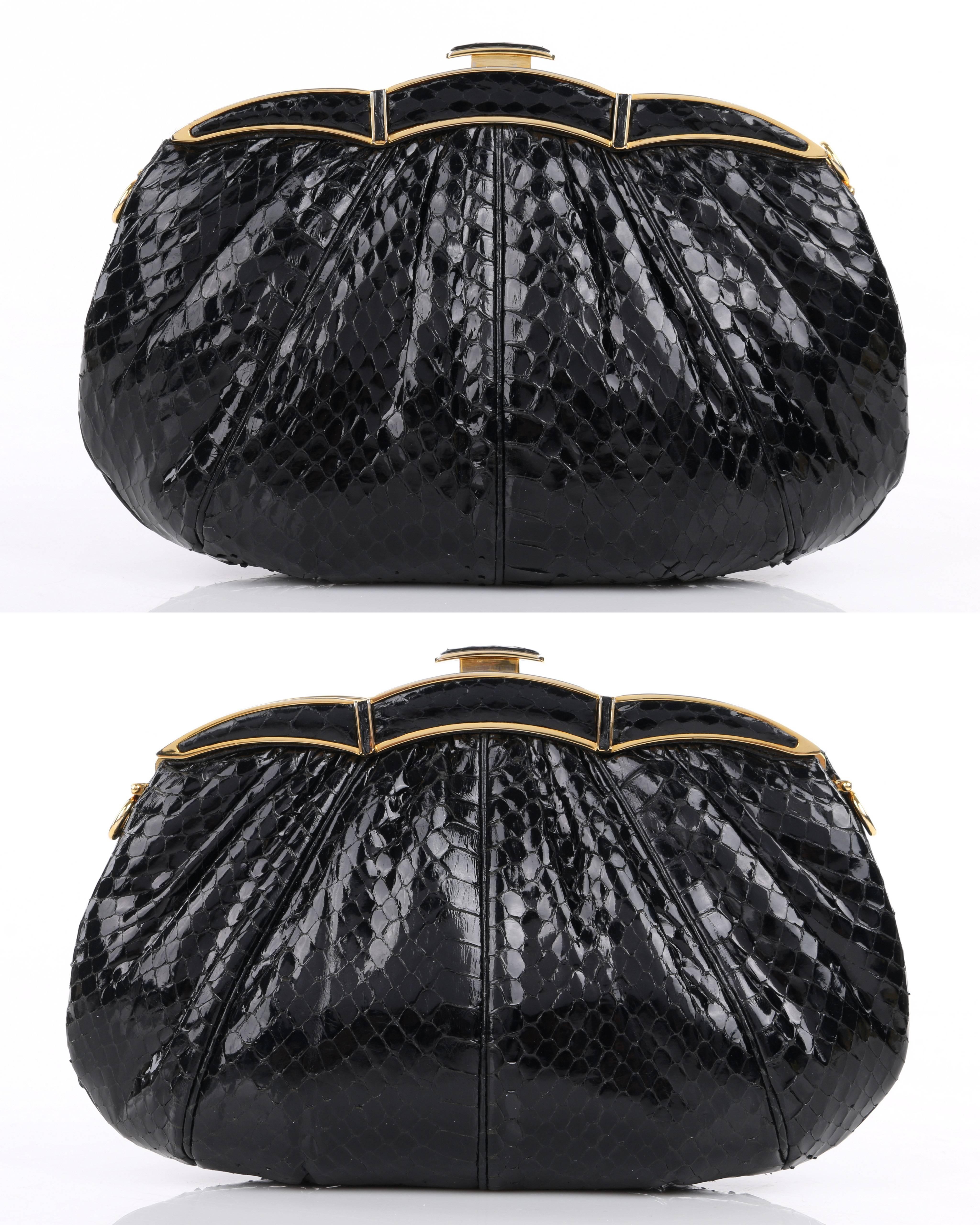Vintage Judith Leiber c.1980's black snakeskin leather evening bag. Black glossy snakeskin exterior gathered into frame at top. Gold-toned scalloped shape frame with push top closure. Thin leather removable crossbody strap attaches with toggle