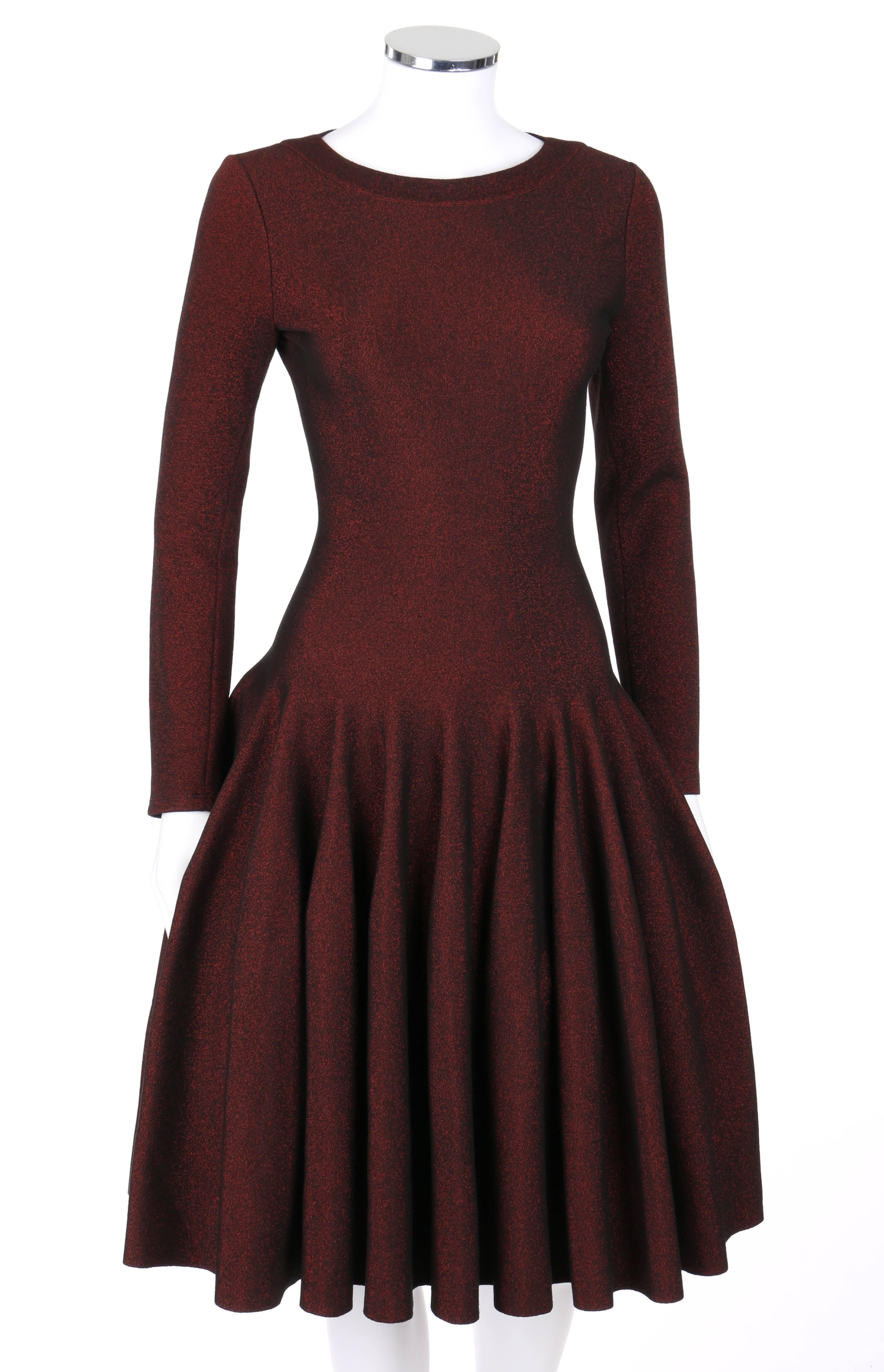 Alaia Paris black and red metallic knit fit and flare cocktail dress new with tags. Bateau neckline with rib knit collar. Long sleeves. Drop waist. Full skirt. Center back invisible zipper with hook and eye closure at top. MSRP $4,230. Marked Fabric