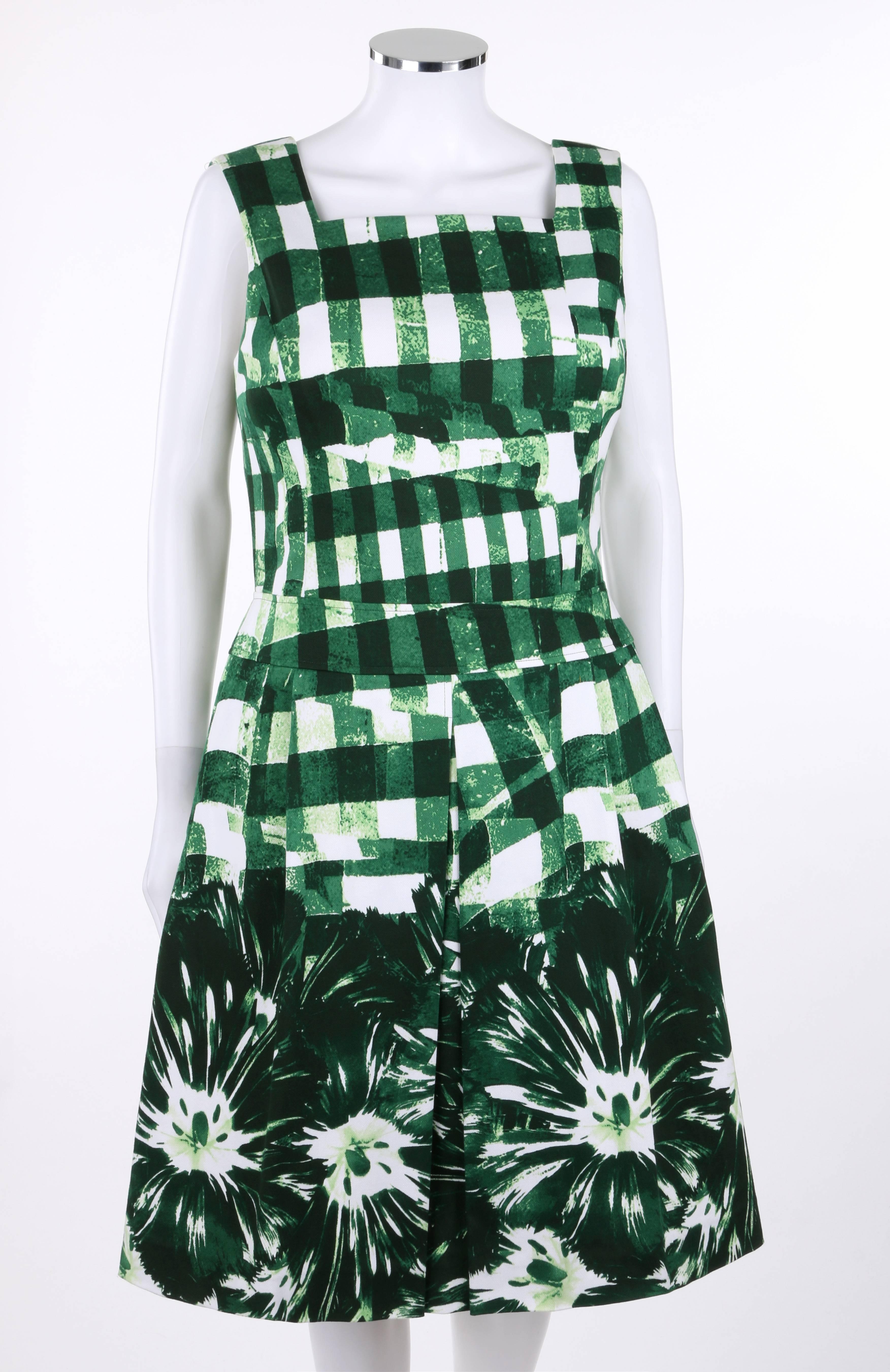 Oscar de la Renta Resort 2013 sleeveless cotton pique day dress. Runway look #36. Green and white painterly gingham print with large floral print at hem. Square neckline. Princess seams. Banded waist. Center front inverted box pleat and two side