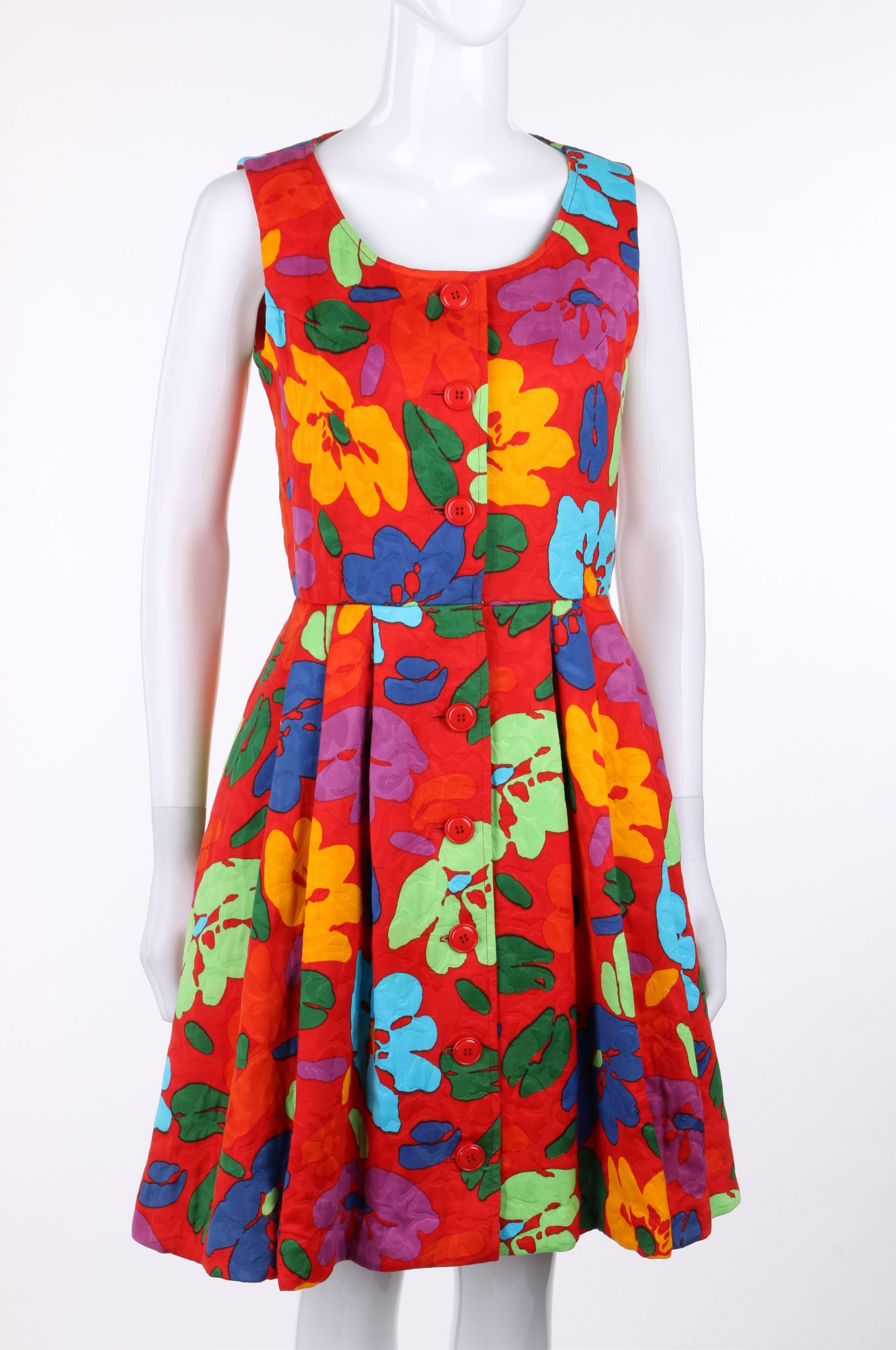 Oscar de la Renta c.1990's red multicolor floral print sleeveless dress in shades of orange, green, blue, and purple. Eight center front button closures with single hook and eye closure at waist. Scoop neckline. Knife pleated skirt. Two front inseam