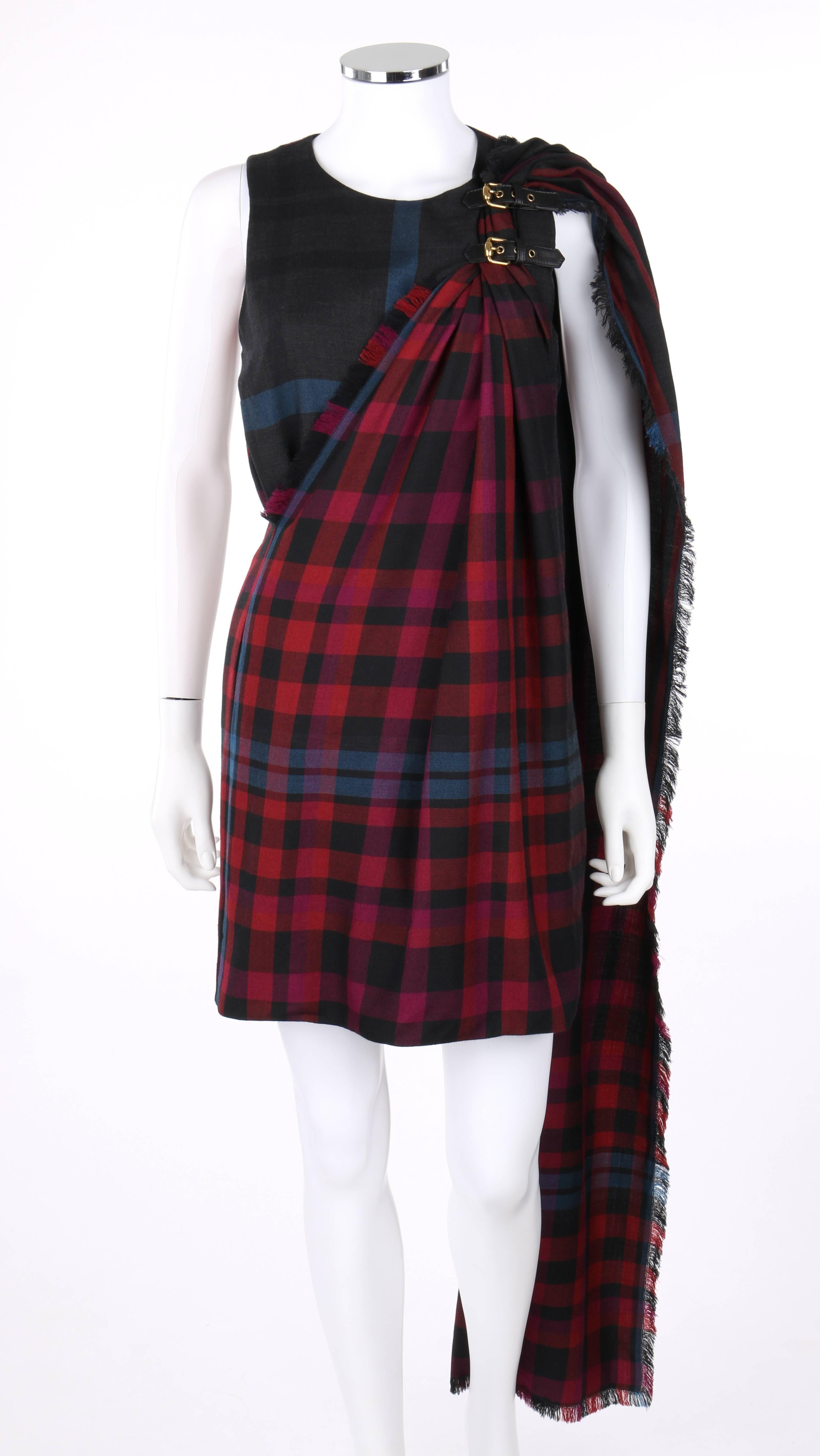 Gucci Autumn/Winter 2008 red and blue tartan plaid kilt shift dress; new with tags. Tartan plaid in shades of red, burgundy, black and blue. Sleeveless shift style. Scoop neckline. Two adjustable black leather straps with gold-toned buckles at left