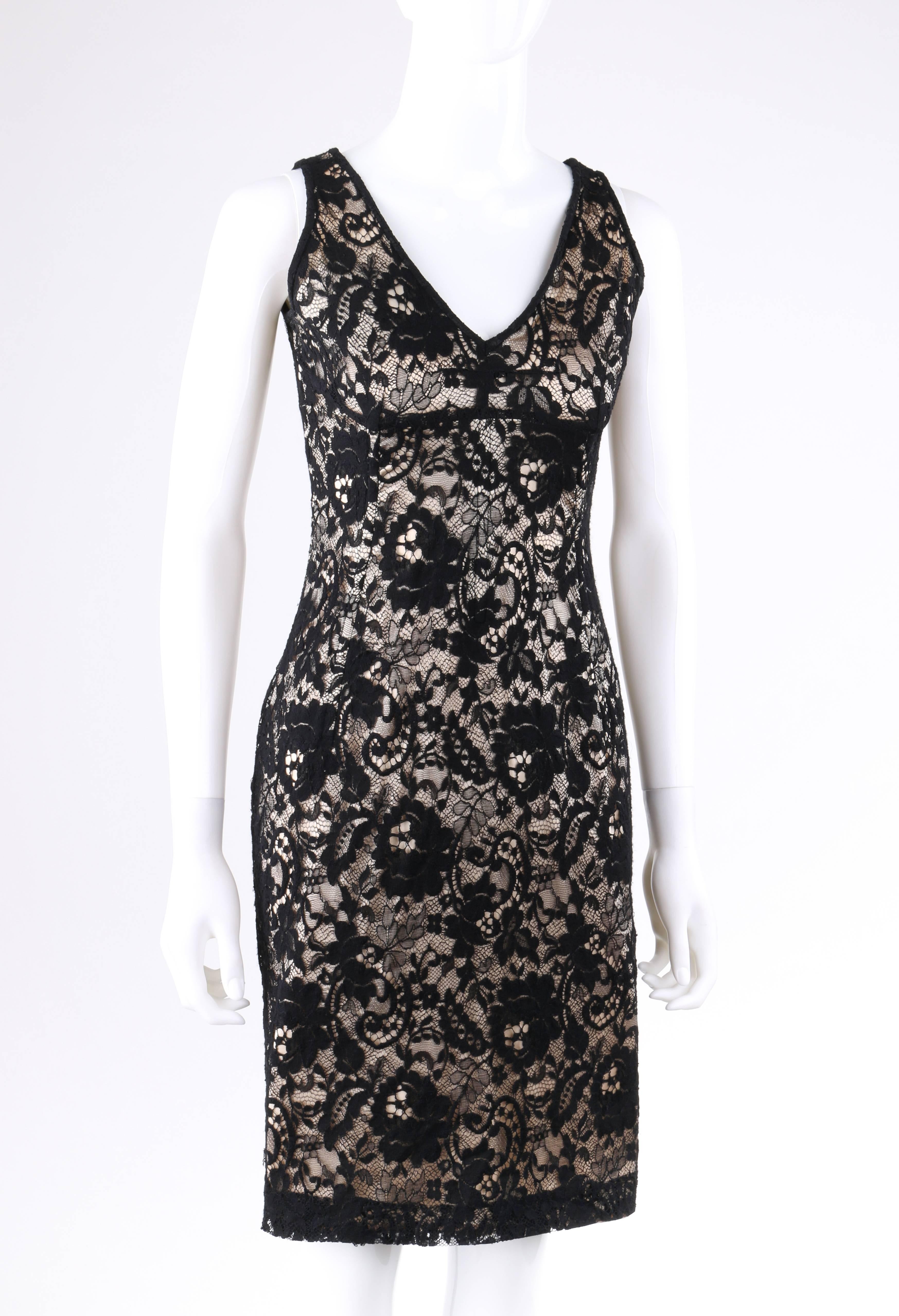 Dolce & Gabbana Autumn/Winter 2011 black floral lace overlay cocktail dress. Black floral lace overlaid nude stretch lining. Sheath style. Sleeveless, v-neckline. Empire waist. Center back invisible zipper with hook and eye closure at top. Fully