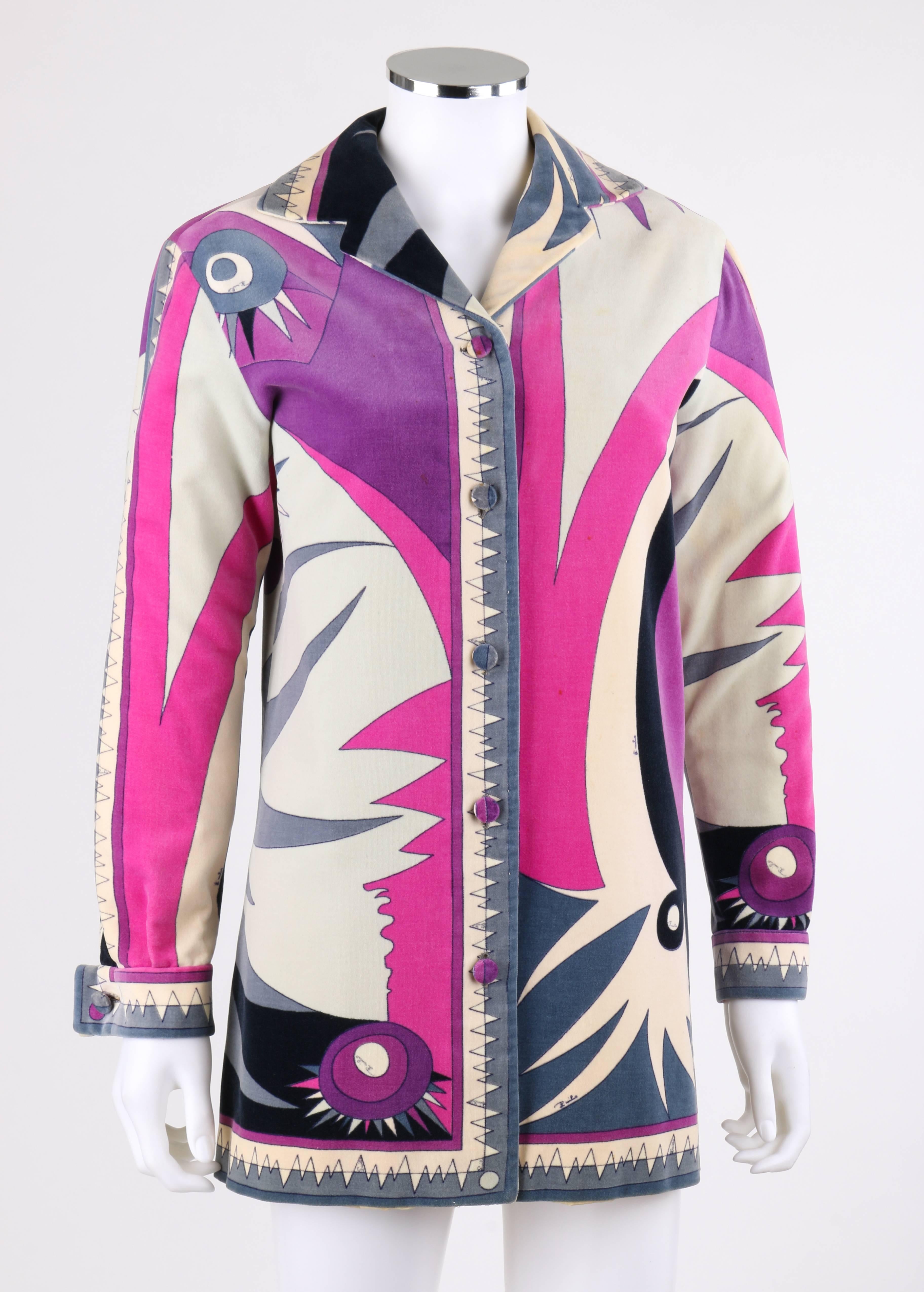 Vintage Emilio Pucci c.1960's cotton velvet jacket with multi color abstract sunburst and wave signature print in shades of purple, fuchsia, gray, and cream. Notched lapel collar. Five center front covered button closures. Long sleeves with french