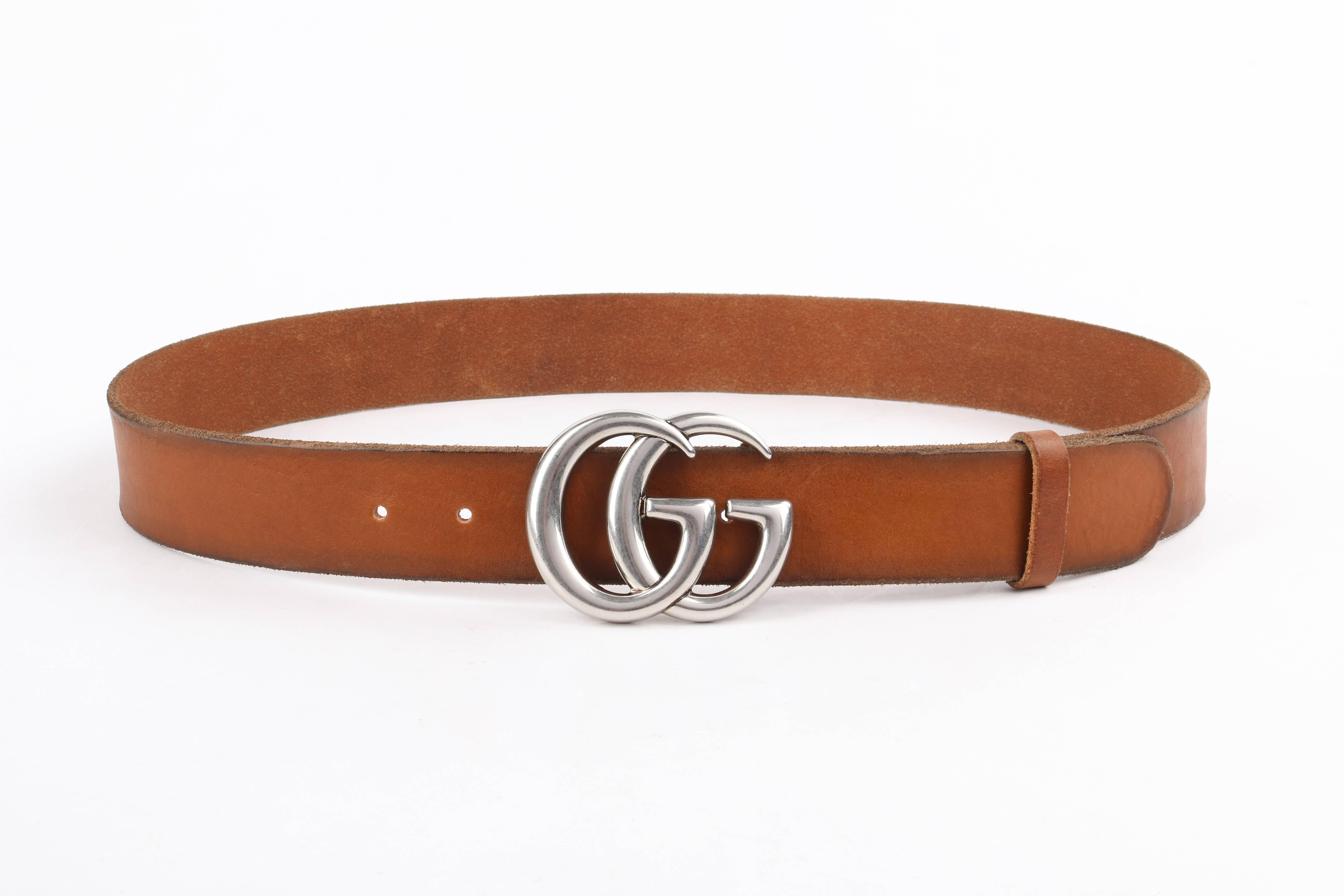 Gucci classic brown leather double G buckle belt. Brown faded distressed leather body with rounded end. Palladium-toned double interlocking G buckle. Marked: "Gucci Made In Italy"; Model: "409416 CVEOT". Marked Size: "95 /