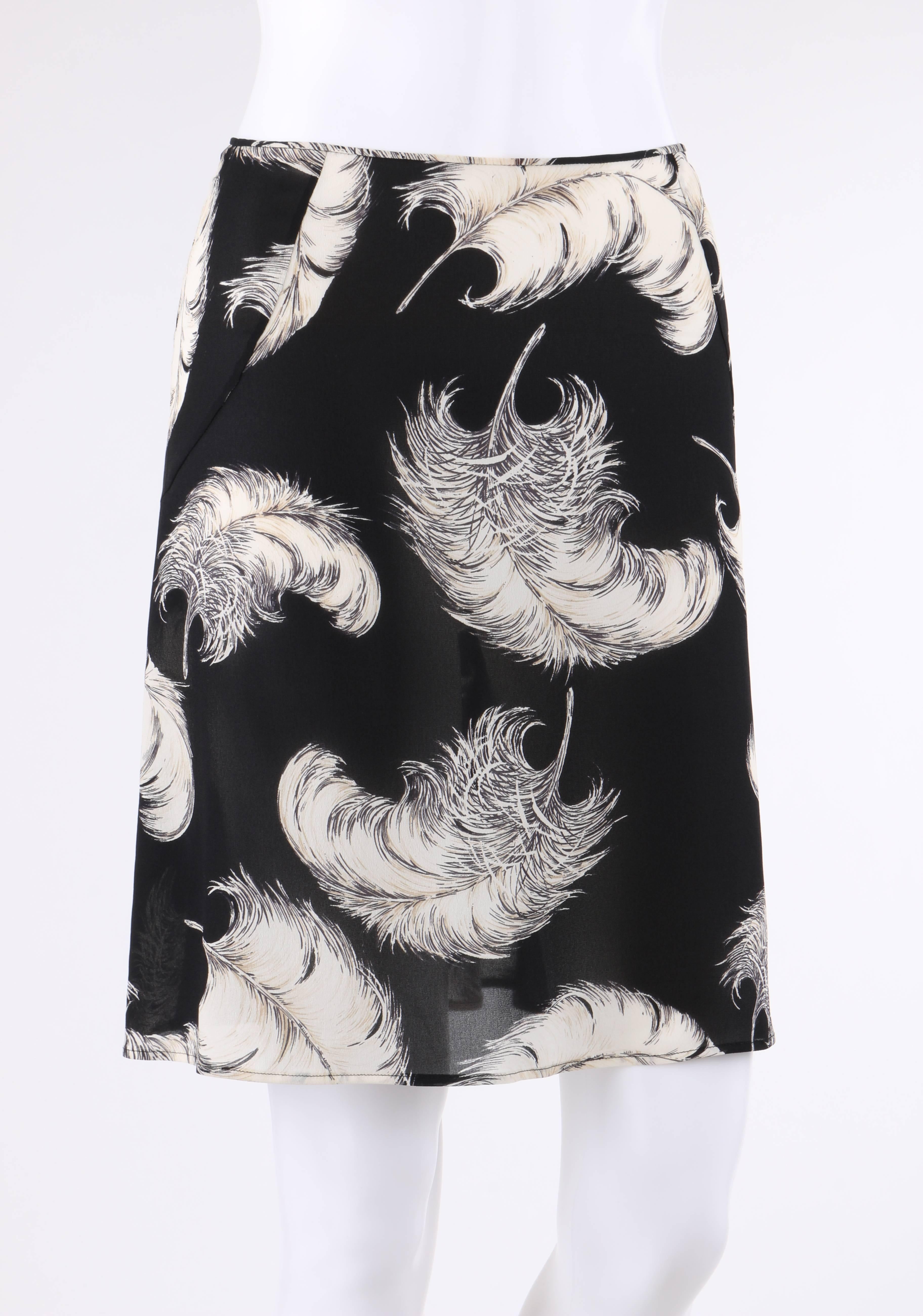 Dolce & Gabbana Autumn/Winter 1997 silk blend chiffon skirt. White large feather plume print on black chiffon. Thin bias bound waistband. Flat front with inset panels at back for a slight flare. Center back invisible zipper with hook and eye closure