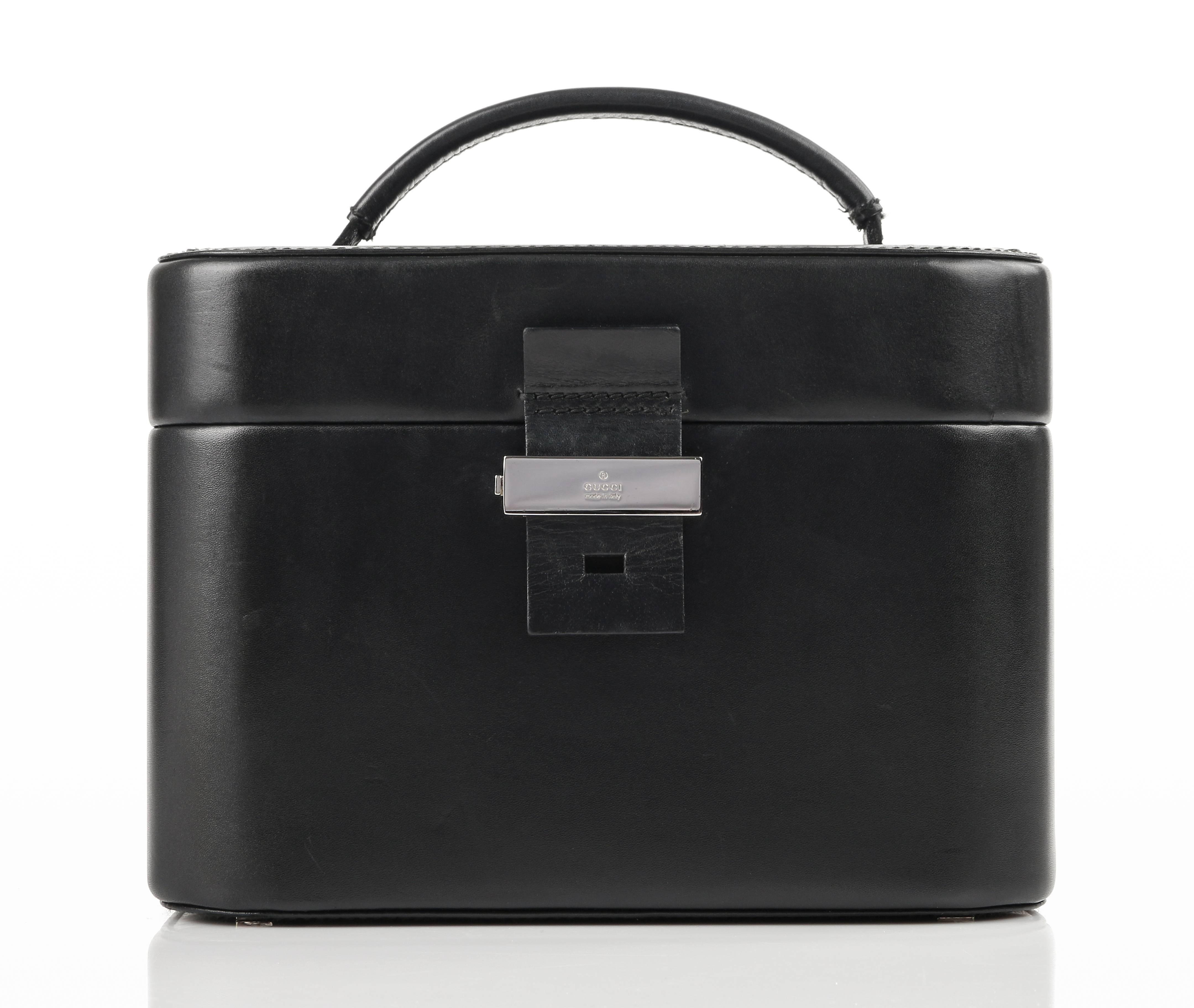Gucci black genuine leather structured train case/cosmetic travel bag. Single flat double rolled handle. Leather tab and silver-toned metal latch top. Interior removable leather backed mirror secured to top of lid with leather strap and slide pocket