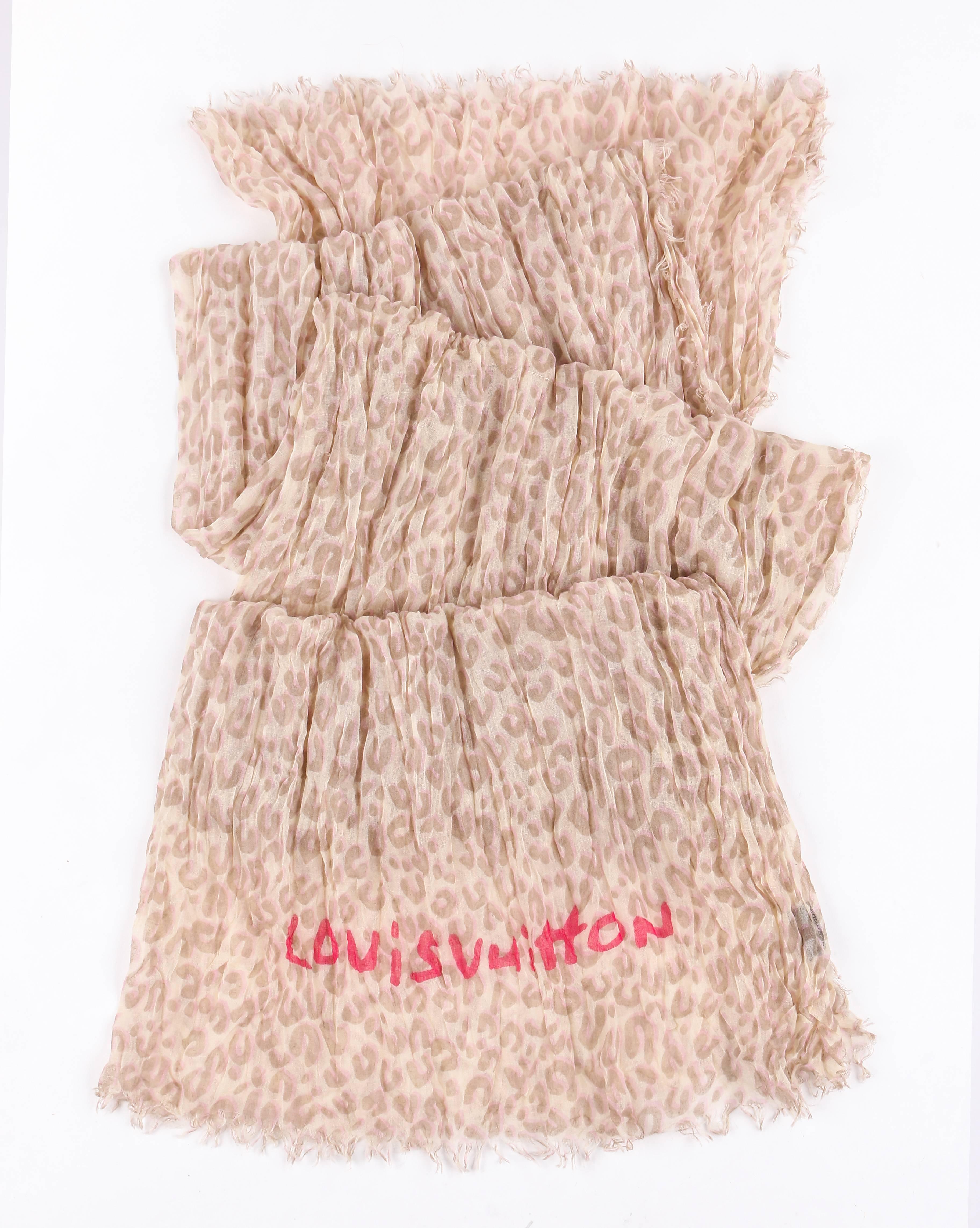 Louis Vuitton Limited Edition beige and pink leopard graffiti print stole designed as a collaboration by Stephen Sprouse and Marc Jacobs. Large oblong shape. Light pink and ecru leopard print over beige. Hot pink "Louis Vuitton" graffiti
